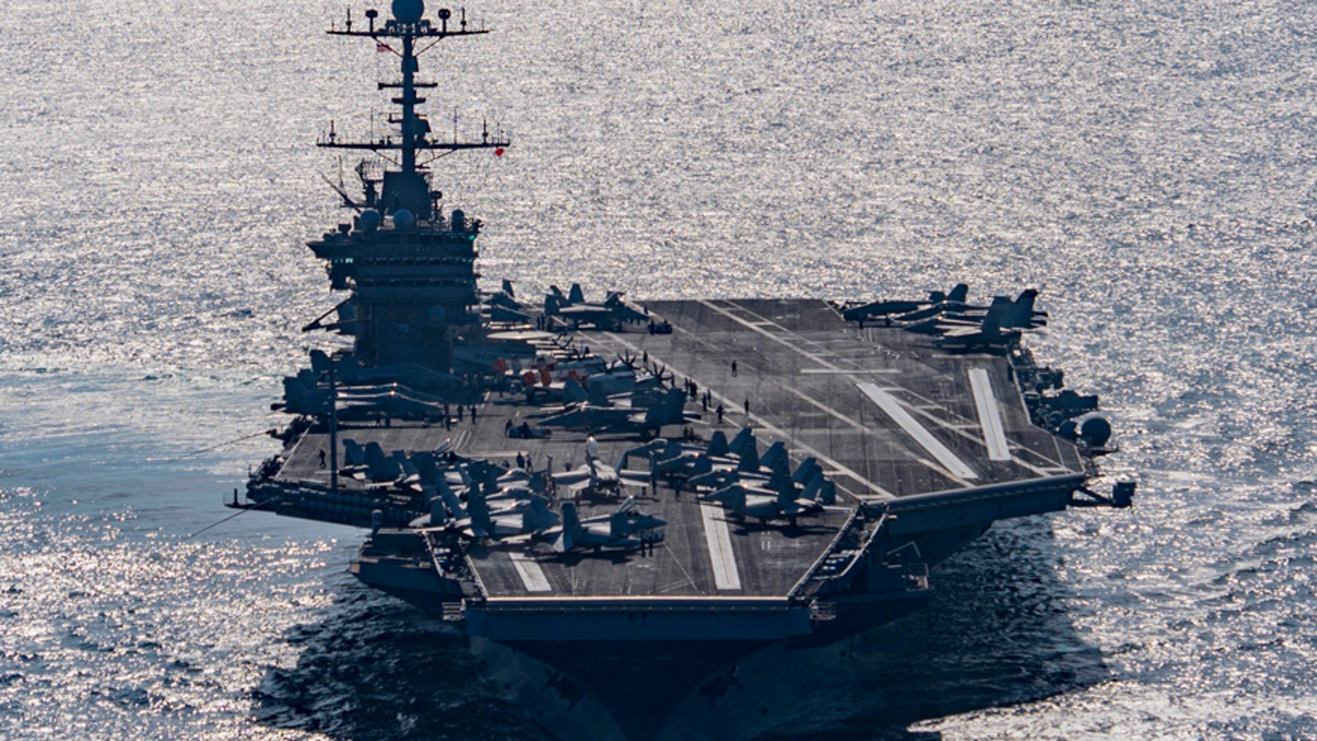 The aircraft carrier USS Harry S. Truman navigates the Gulf of Oman.