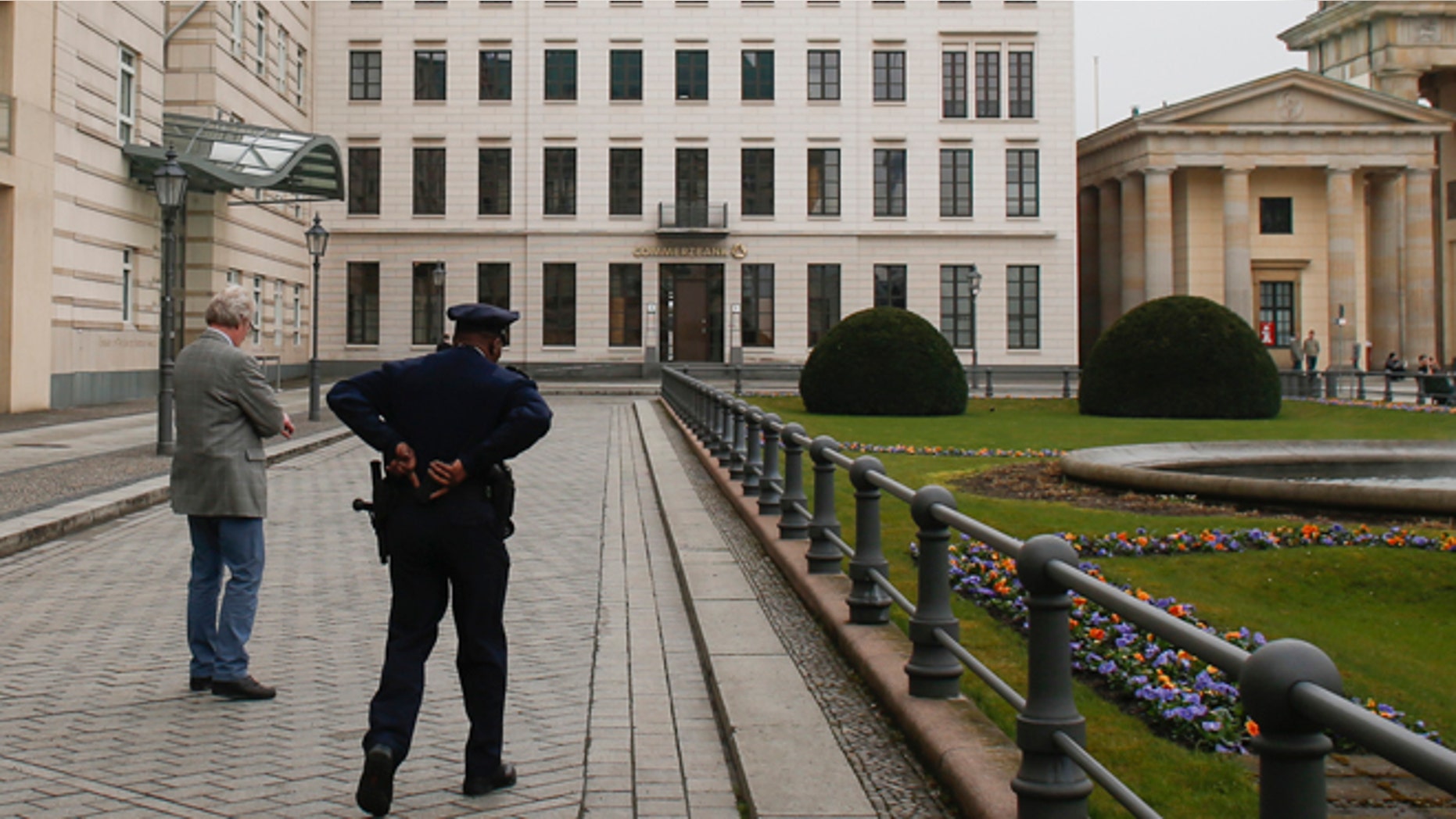 April 16, 2013: In this file photo, United States security officers patrol in front of the U.S. embassy in Berlin, Germany. Germany took the dramatic step Thursday of asking the top U.S. intelligence official in Berlin to leave the country, following two reported cases of suspected U.S. spying and the yearlong spat over eavesdropping by the National Security Agency.