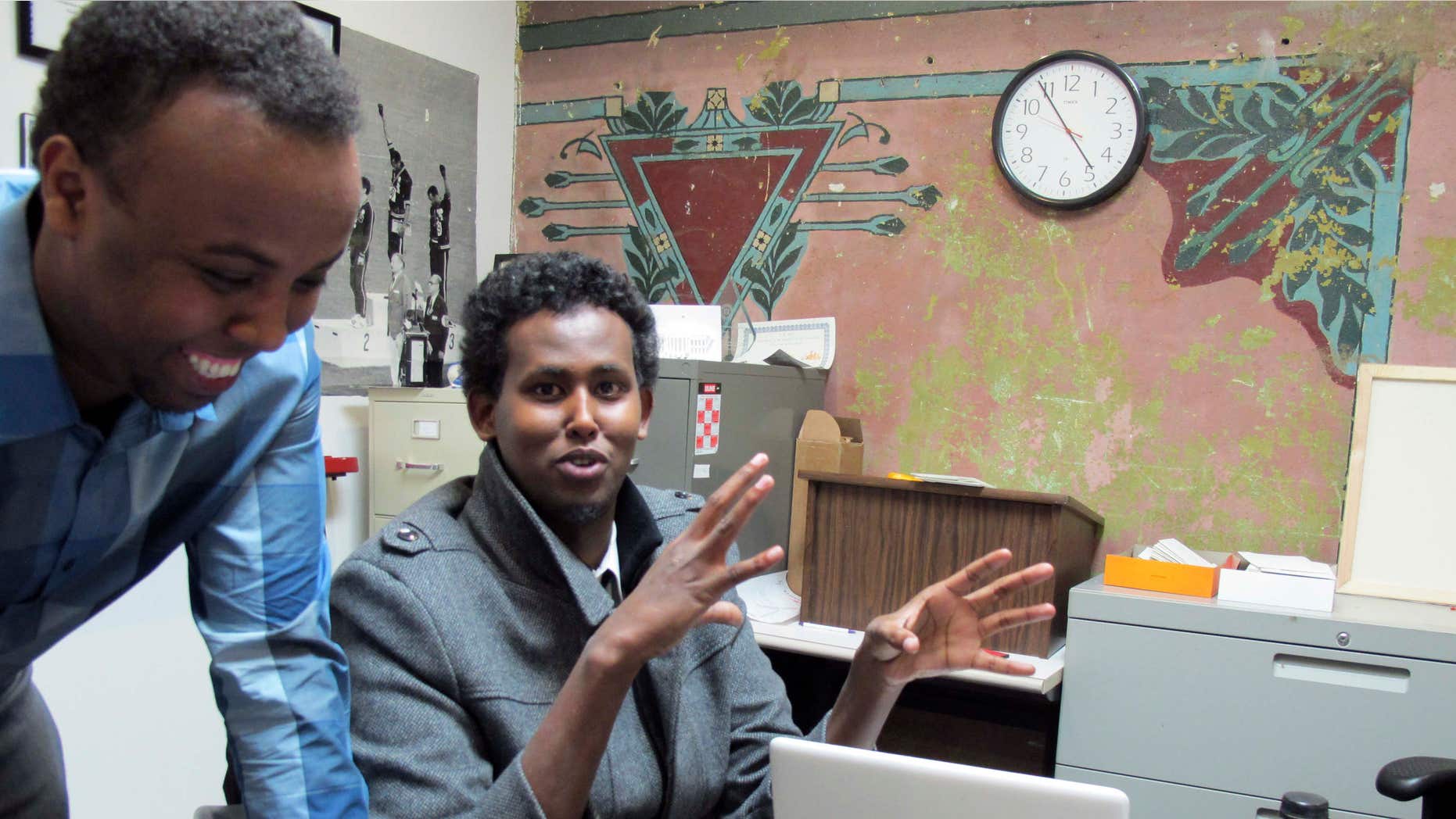 Feb. 27, 2014: Mohamed Farah, left, executive director of Ka Joog, talks with Vice President Daud Mohamed in Minneapolis. U.S. Attorney Andy Luger will lead a delegation of local law enforcement and Somali community leaders, including Farah, to a meeting in Washington.
