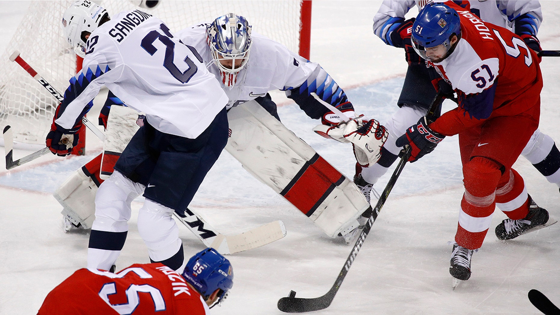 Roman Horak (51), of the Czech Republic, takes a shot at goalie Ryan Zapolski (30), of the United States, during the first period of the quarterfinal round of the men's hockey game at the 2018 Winter Olympics in Gangneung, South Korea, Wednesday, Feb. 21, 2018. (AP Photo/Jae C. Hong)