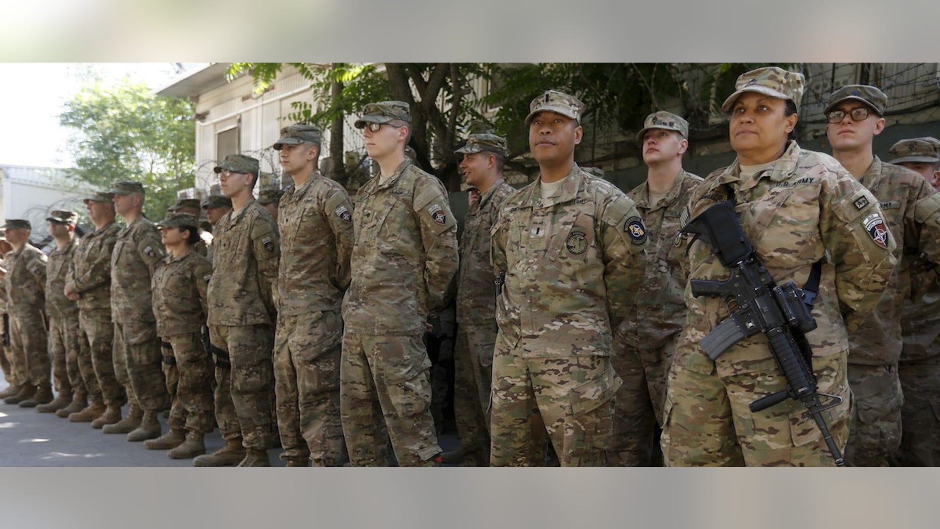 U.S. troops attend a ceremony to commemorate Memorial Day in Kabul, May 25, 2015. Memorial Day is observed annually in the U.S. on the last Monday of May to honor the nation's fallen members of the military. (REUTERS/Omar Sobhani)