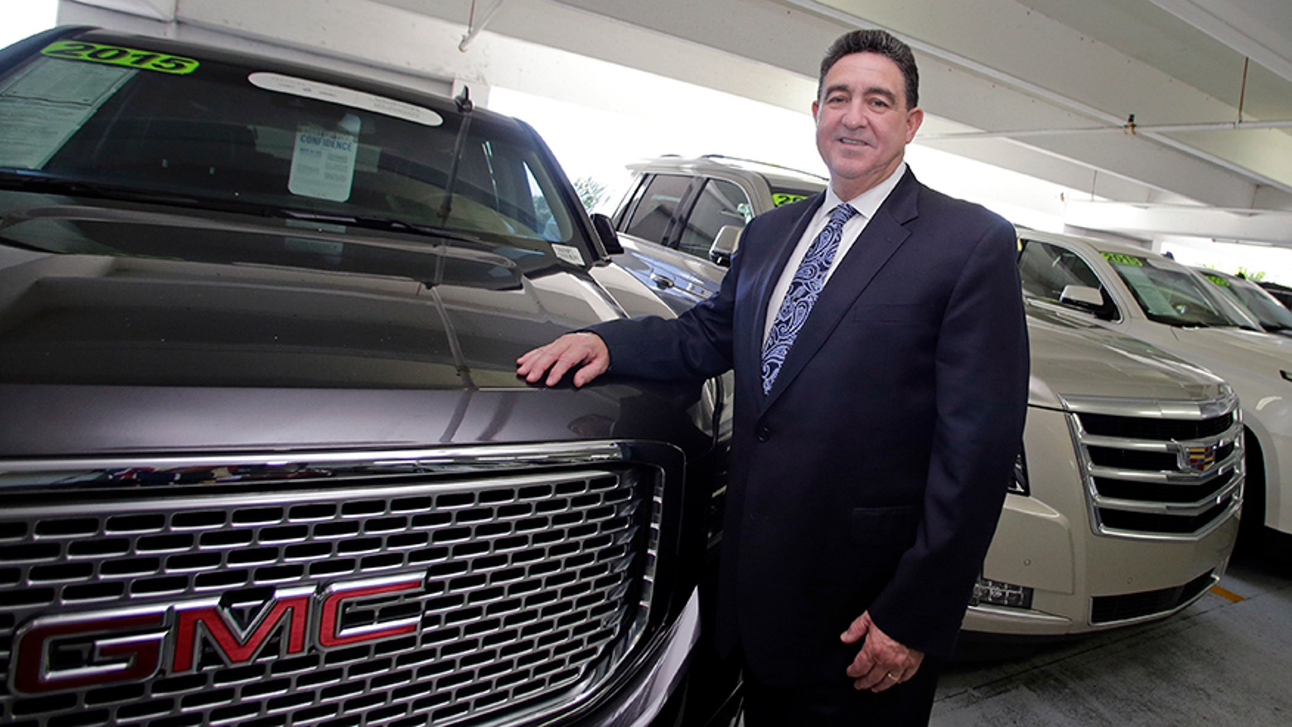 General sales manager Beny Ledesma poses for a photo at Williamson Cadillac Buick GMC dealership in Miami.