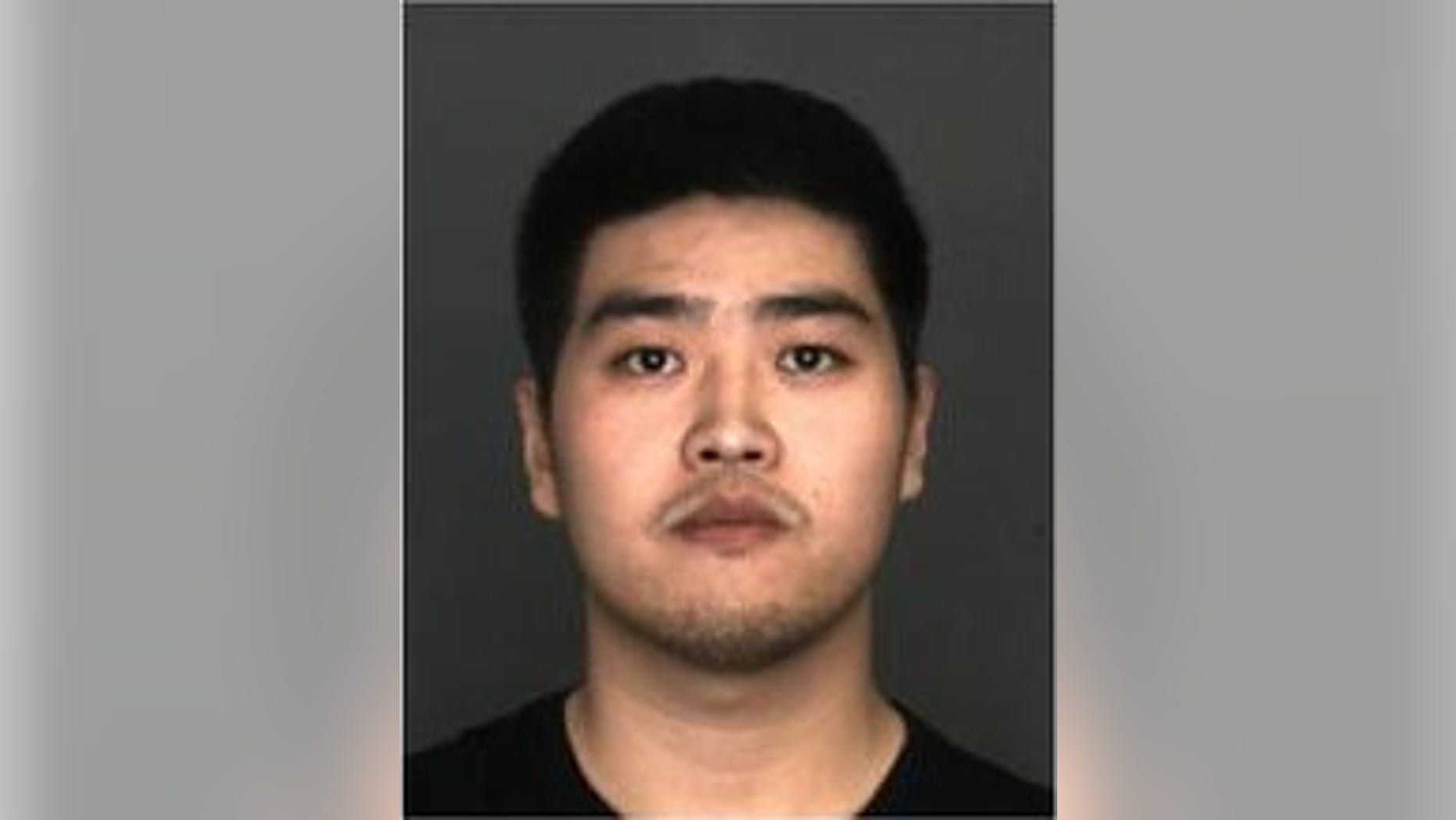 Enping Qu, 22, was accused of pouring boiling water on his girlfriend's dog.