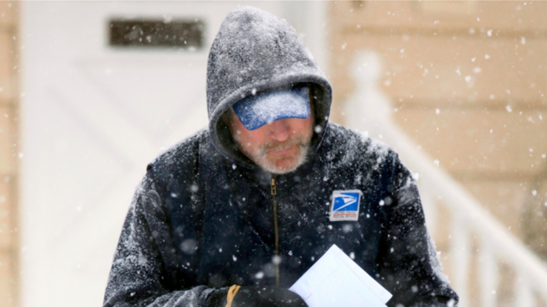 Dec. 19, 2009: U. S. Post Office letter carrier Tim Bell delivers the mail during a snow storm in Havertown, Pa.
