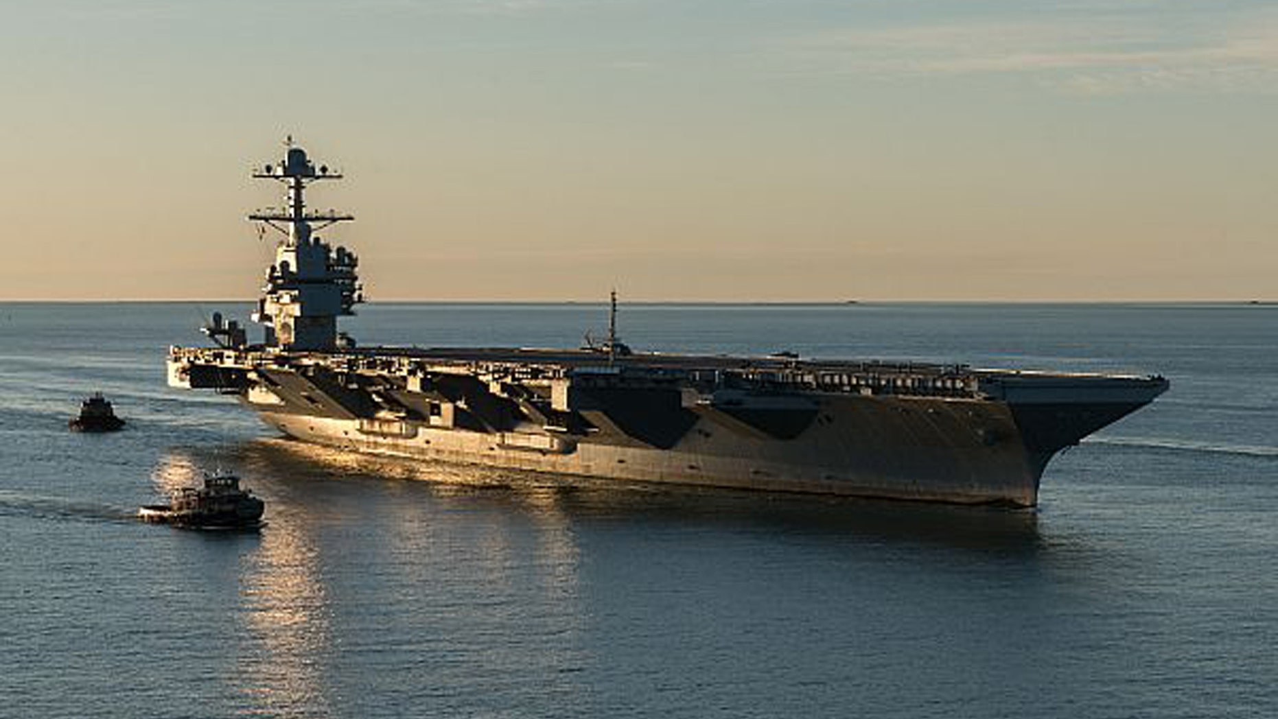 File photo: (April 14, 2017) The aircraft carrier Pre-Commissioning Unit (PCU) Gerald R. Ford (CVN 78) pulls into Naval Station Norfolk for the first time. (U.S. Navy photo by Matt Hildreth courtesy of Huntington Ingalls Industries/Released) (©Newport News Shipbuilding 2017)