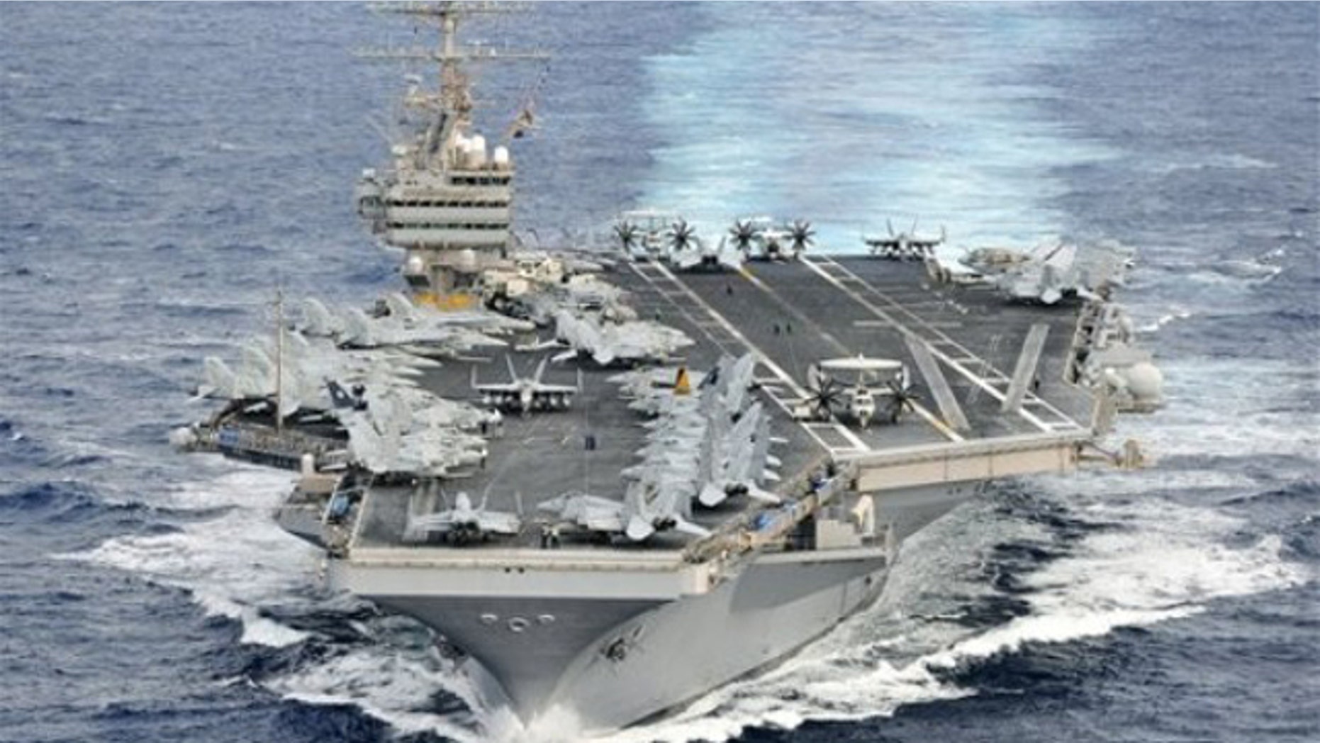 In this photo taken Dec. 16, 2011 and released by U.S. Navy, its aircraft carrier USS Abraham Lincoln (CVN 72) transits through the Pacific Ocean.