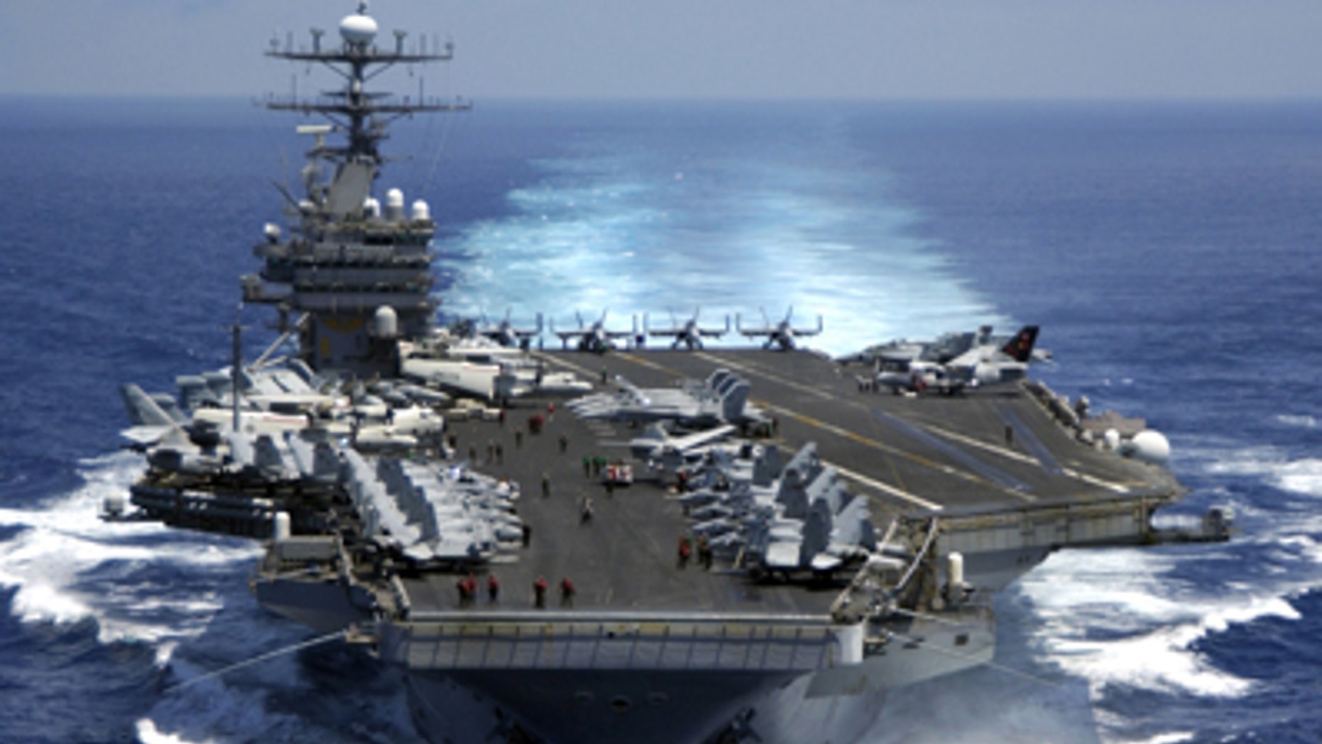 March 15, 2005: The nuclear powered aircraft carrier USS Carl Vinson (CVN 70) plows through the Indian Ocean as aircraft on its flight deck are prepared for flight operations.