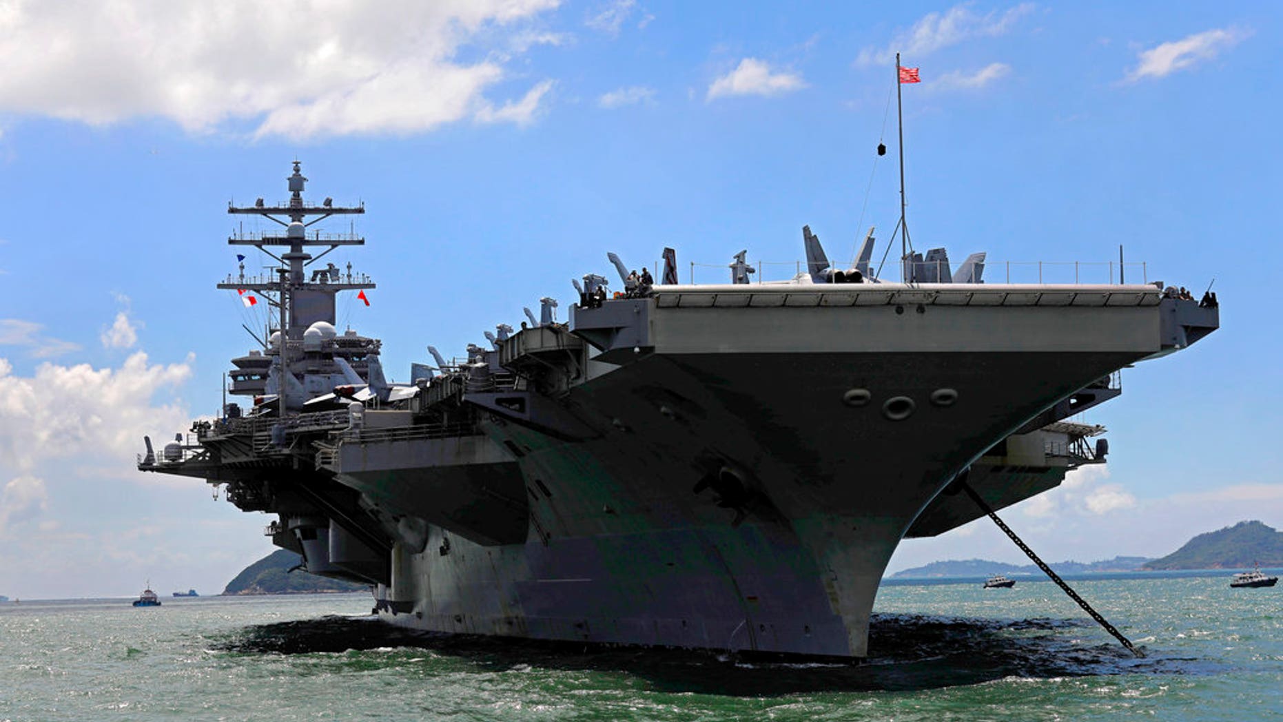 FILE - In this Monday, Oct. 2, 2017, file photo, the USS Ronald Reagan aircraft carrier arrives in Hong Kong. A U.S. Navy C-2 Greyhound plane carrying 11 crew and passengers crashed into the Pacific Ocean on Wednesday, Nov. 22, 2017, while on the way to the USS Ronald Reagan the Navy said. (AP Photo/Vincent Yu, File)
