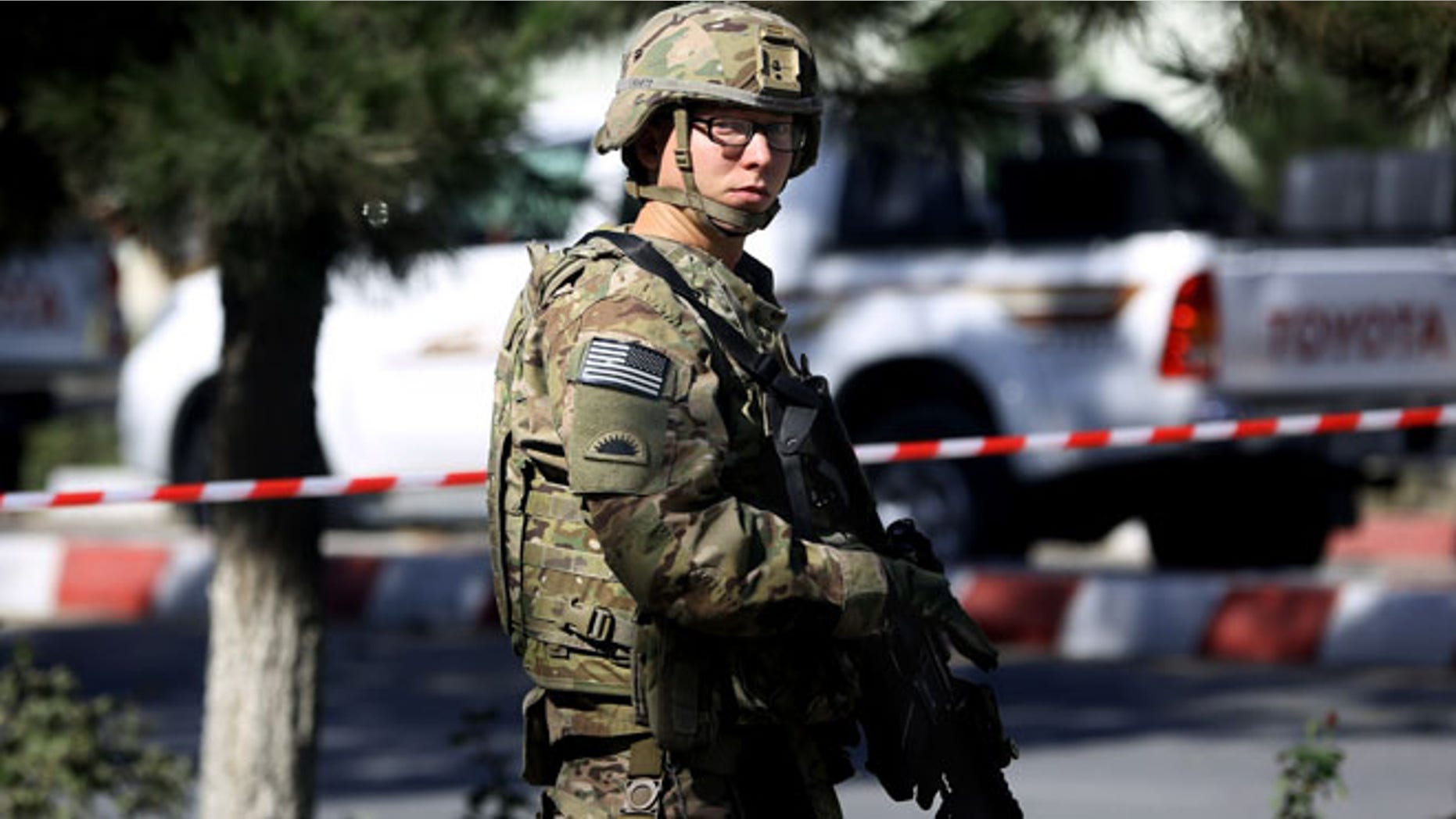 Sept. 16, 2014: A U.S. solider stands guard at the site of a suicide attack near a U.S. military camp in Kabul, Afghanistan. (AP)