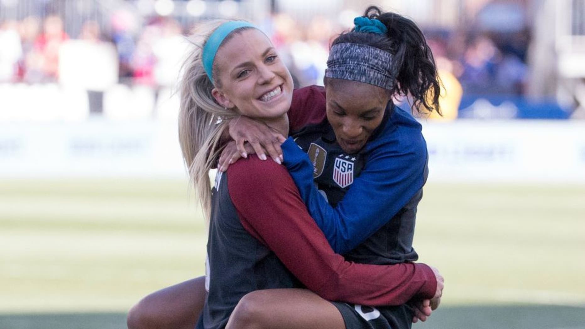 CHESTER, PENNSYLVANIA - APRIL 10: Julie Johnston #8 and Crystal Dunn #16 of the United States hug each other after the match against Colombia at Talen Energy Stadium on April 10, 2016 in Chester, Pennsylvania. The United States defeated Colombia 3-0. (Photo by Mitchell Leff/Getty Images) *** Local Caption *** Julie Johnston;Crystal Dunn