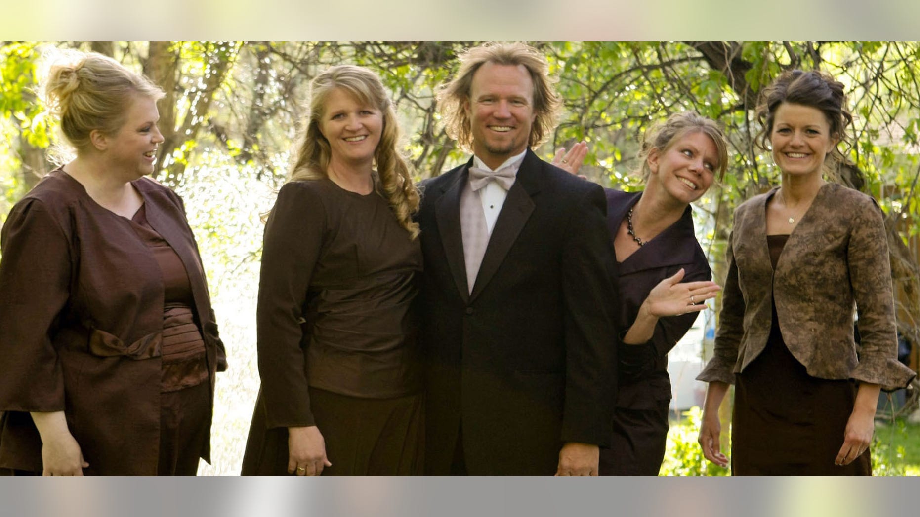 Kody Brown, center, poses with his wives, from left, Janelle, Christine, Meri, and Robyn in a promotional photo for TLC's reality TV show, "Sister Wives."