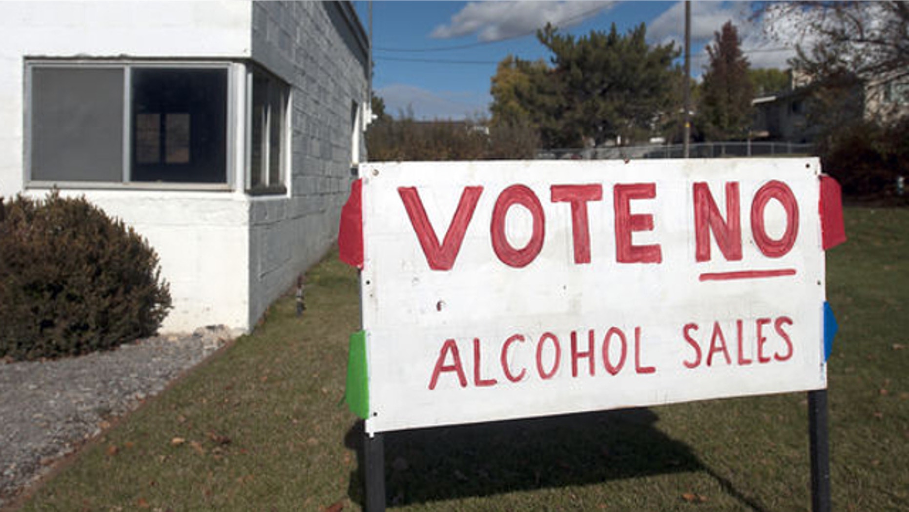 Nov. 4, 2013: A sign stands outside a business in Hyde Park, Utah, urging voters to not allow alcohol sales in the town.