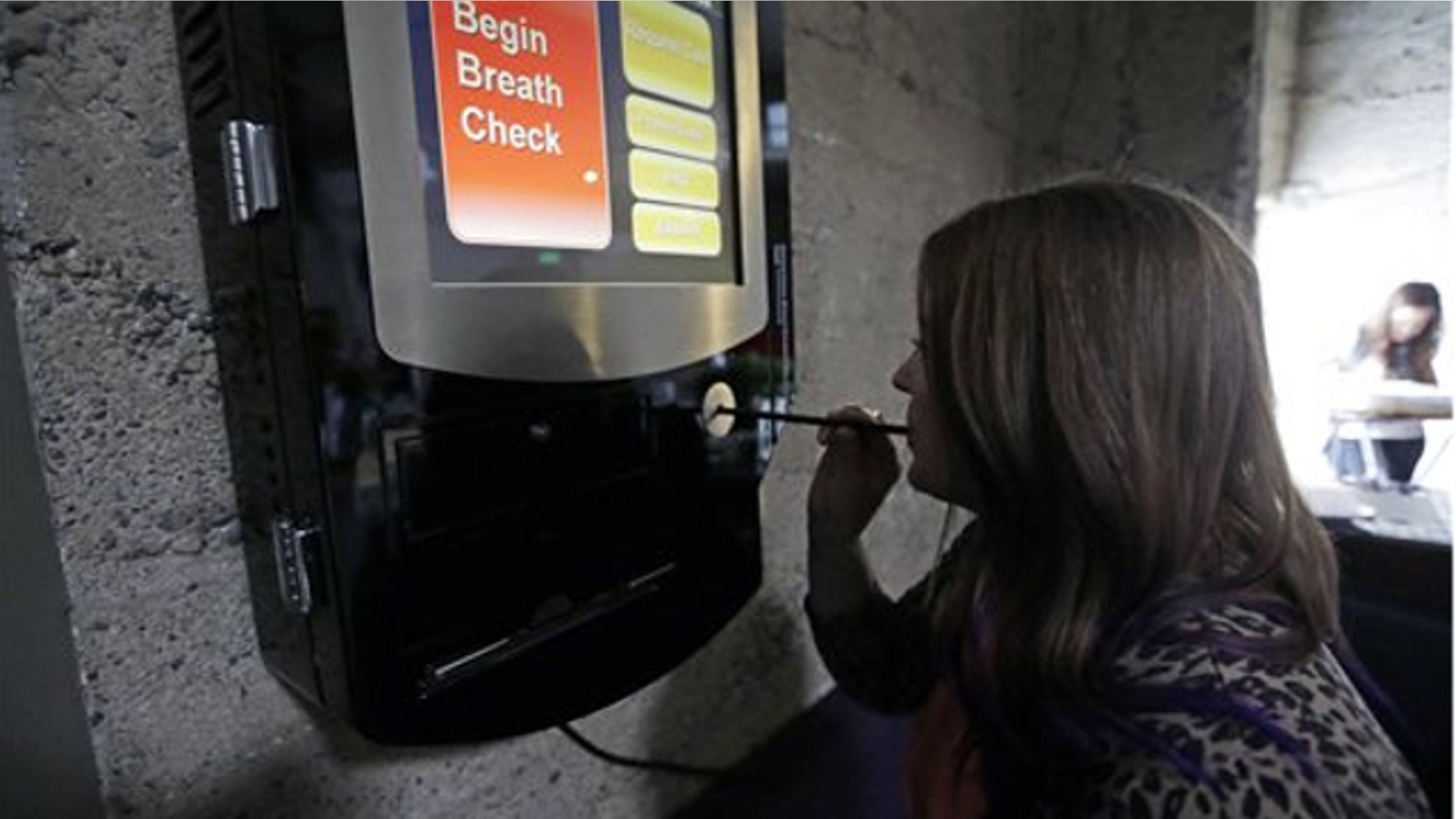 Feb. 14, 2014: Zest's special events manager Lindsy Wing demonstrates their breathalyzer at Zest Kitchen & Bar in Salt Lake City.