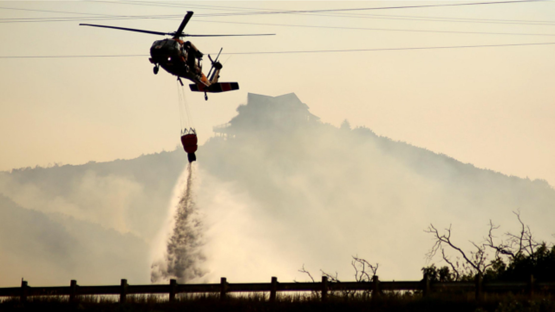 Aug. 14, 2013: A helicopter drops fire water on the Rockport fire in Rockport, Summit County.