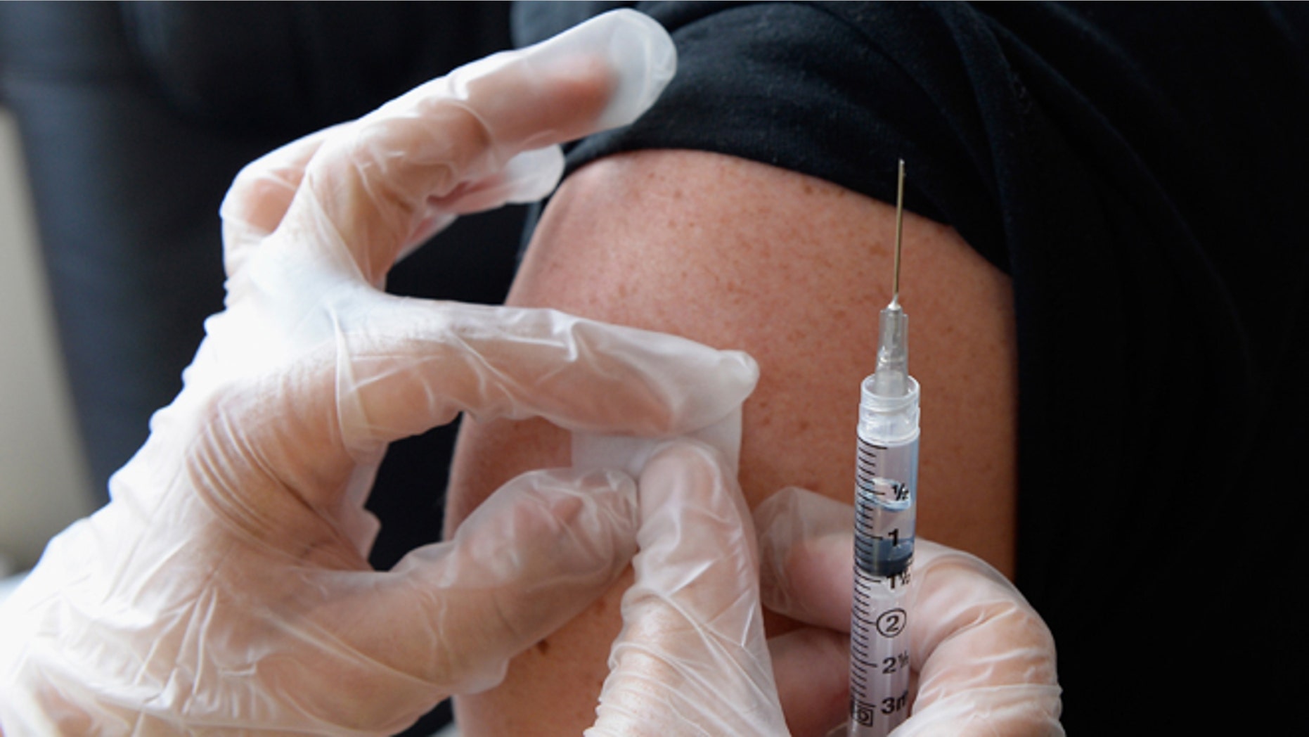 HOLLYWOOD, CA - APRIL 15: People receive a free meningitis vaccine from Dr. Wayne Chen at the AIDS Healthcare Foundation pharmacy on April 15, 2013 in Hollywood, California. The AIDS Healthcare Foundation started free meningitis vaccines after a West Hollywood man died from the disease. (Photo by Kevork Djansezian/Getty Images)