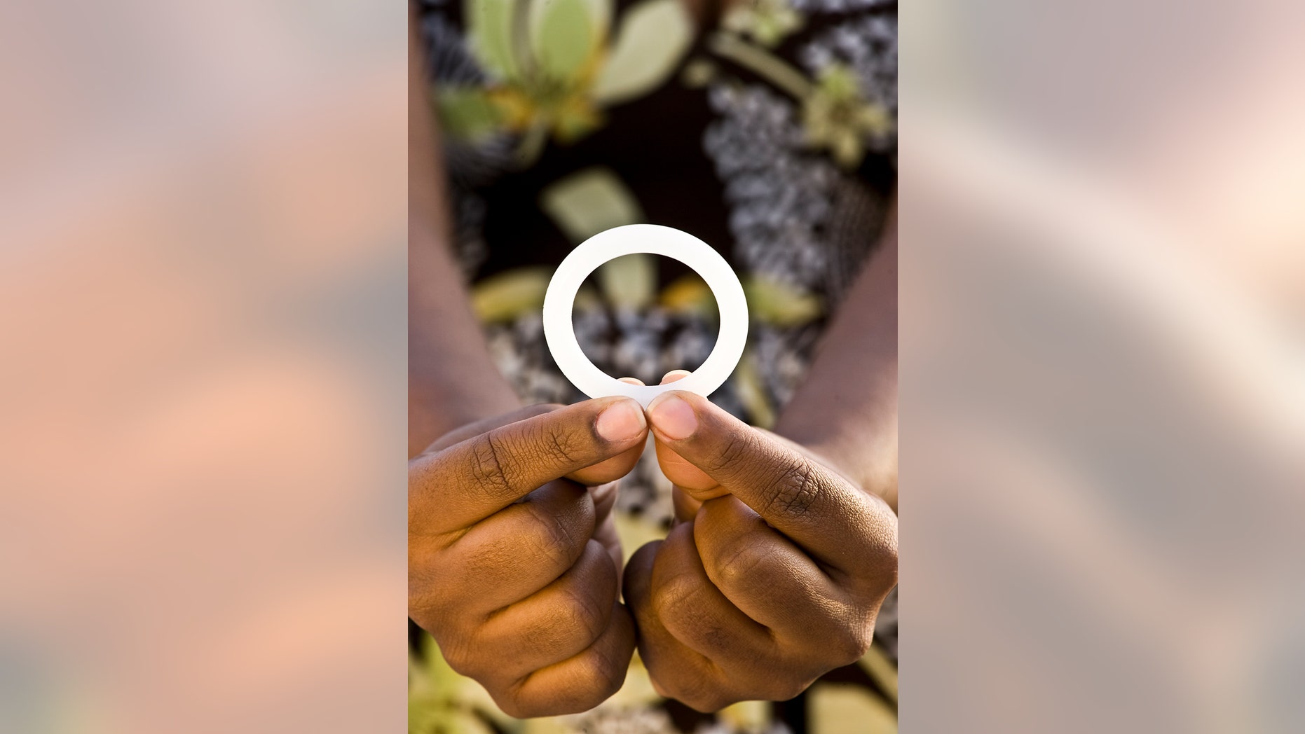 This photo provided by the International Partnership for Microbicides shows a ring that is coated with an anti-AIDS drug designed for women to insert into the vagina once a month to reduce the risk of HIV infection. Researchers say women who inserted a vaginal ring coated with an anti-AIDS drug once a month were partially protected against HIV infection. Two large studies in Africa found the effect was modest, reducing overall HIV infection by about a third. But surprisingly, the ring worked far better in women 25 and older, leaving researchers wondering if younger women who got little to no benefit simply didnt use the device properly. (Andrew Loxley/International Partnership for Microbicides via AP)