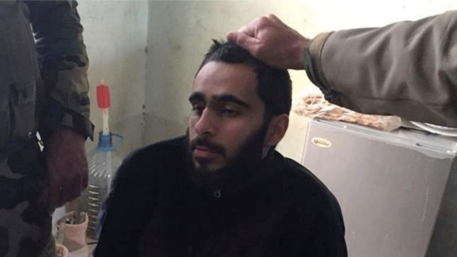 In this photo provided by the U.S. District Court, Alexandria, Va., Mohamad Khweis, 27, of Alexandria, Va., is seen. To the Kurdish peshmerga forces patrolling northern Iraq in March 2016, Khweis, appeared to be a member of the Islamic State terror group. They certainly didn't peg him as a bus driver from the wealthy suburbs of Washington. (U.S. District Court, Alexandria, Va. via AP)