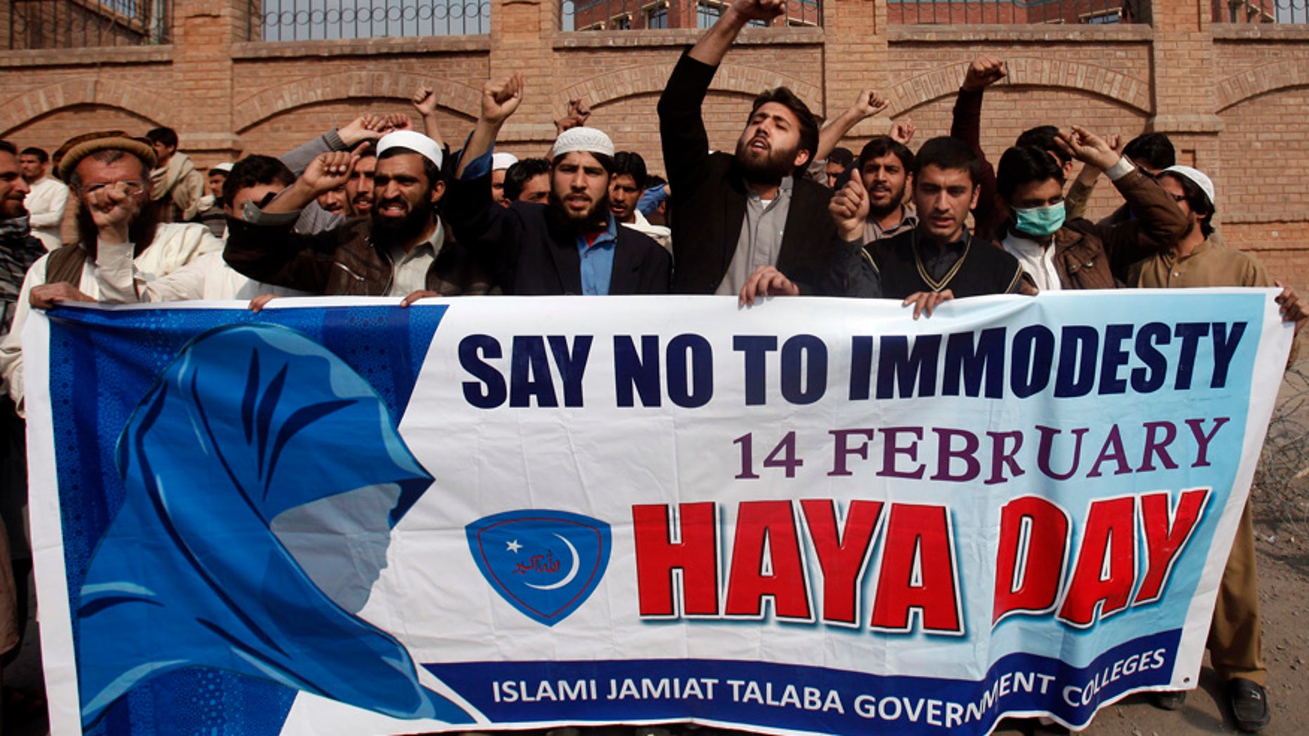 Feb. 14, 2014: Supporters of Islami Jamiat Talaba, a student wing of Pakistan's religious and political party Jamaat-e-Islami, shout slogans to condemn Valentine's Day during a protest at the University of Peshawar.