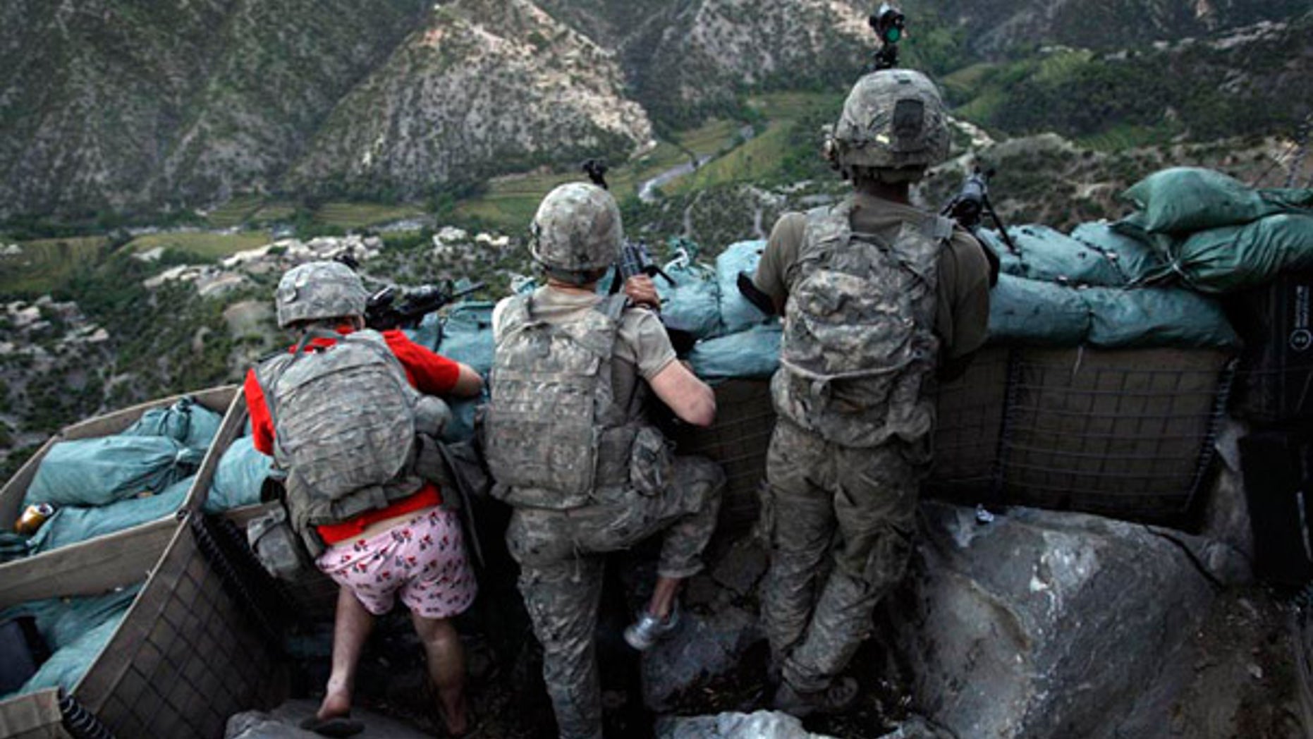 May 11 2009: U.S. soldiers responded to Taliban fire outside their bunker in Korengal Valley, Afghanistan.