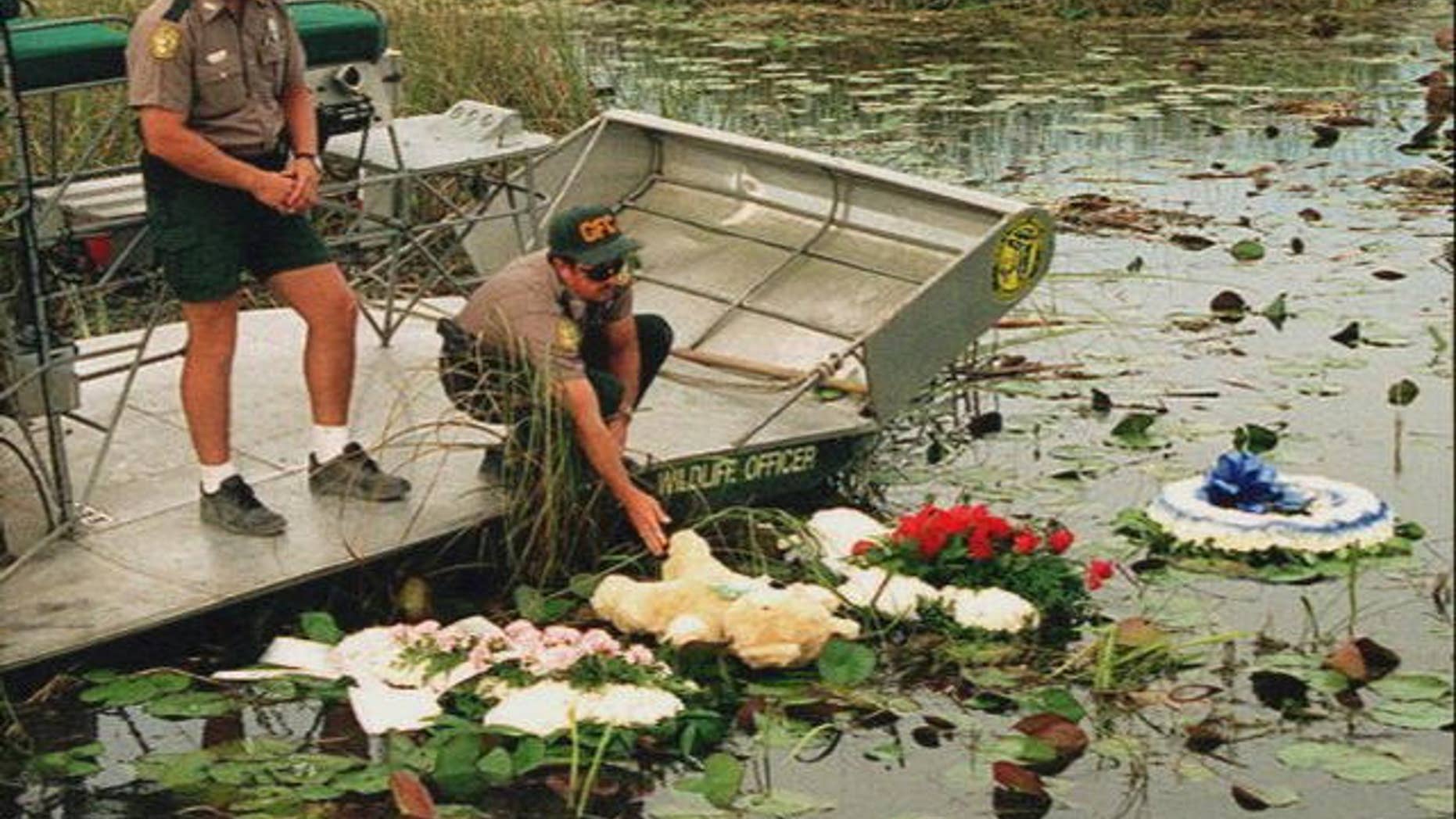 May 1996: Officers lay wreaths on the water at the site of the ValuJet Flight 592 crash.