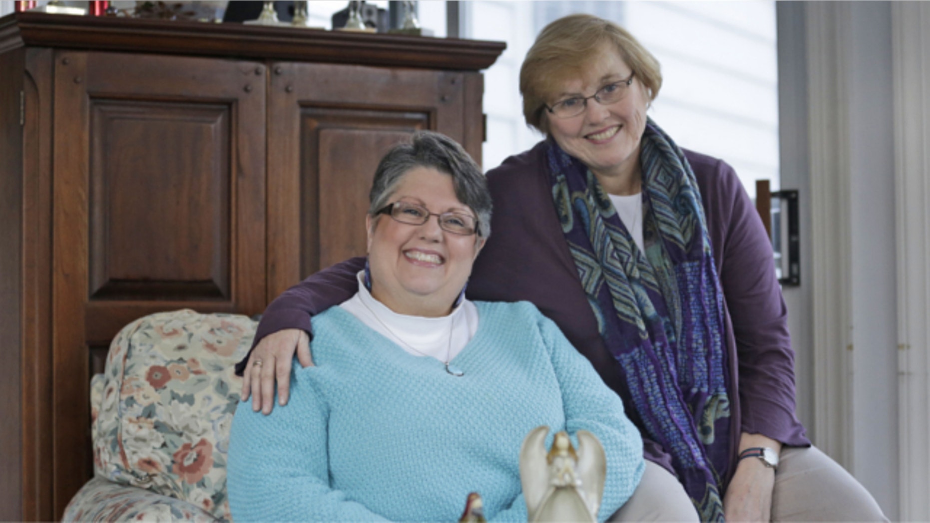FILE: Nov. 25, 2013: Carol Schall, left, and her partner, Mary Townley, are shown at their home in Richmond, Va. The couple, who were married in California in 2008, decided to join a lawsuit challenging Virginia's ban on same-sex marriage.