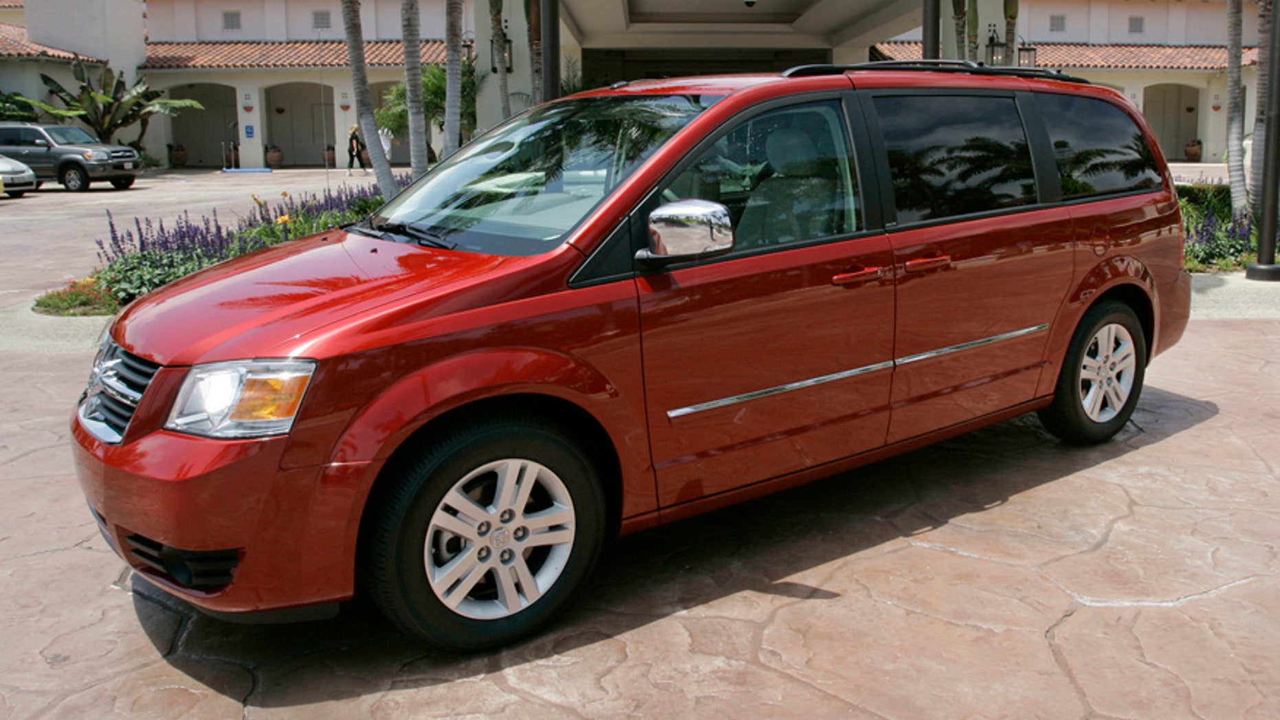 FILE - This July 17, 2007 file photo shows the 2008 Dodge Grand Caravan at the Four Seasons Hotel in Carlsbad, Calif. On Wednesday, June 18, 2014, the National Highway Traffic Safety Administration posted documents on its website detailing an investigation of about 700,000 Dodge Journey SUVs and Chrysler Town and Country and Dodge Grand Caravan minivans from the 2008 to 2010 model years. The agency wants to see if the keys can fall out of the run position under harsh roadway conditions. (AP Photo/Lenny Ignelzi, File)