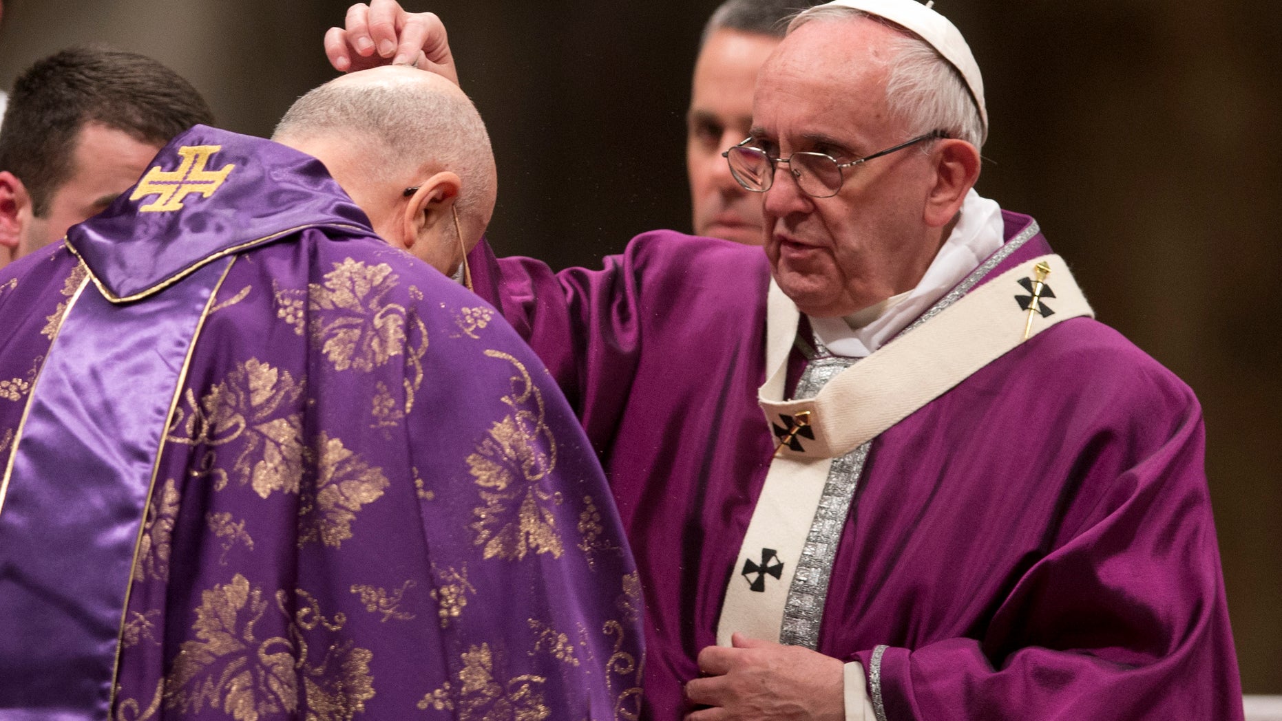 Feb. 10, 2016: Pope Francis places ashes on the head of Cardinal Tarcisio Bertone during the Ash Wednesday mass, in St. Peter's Basilica at the Vatican. (AP)