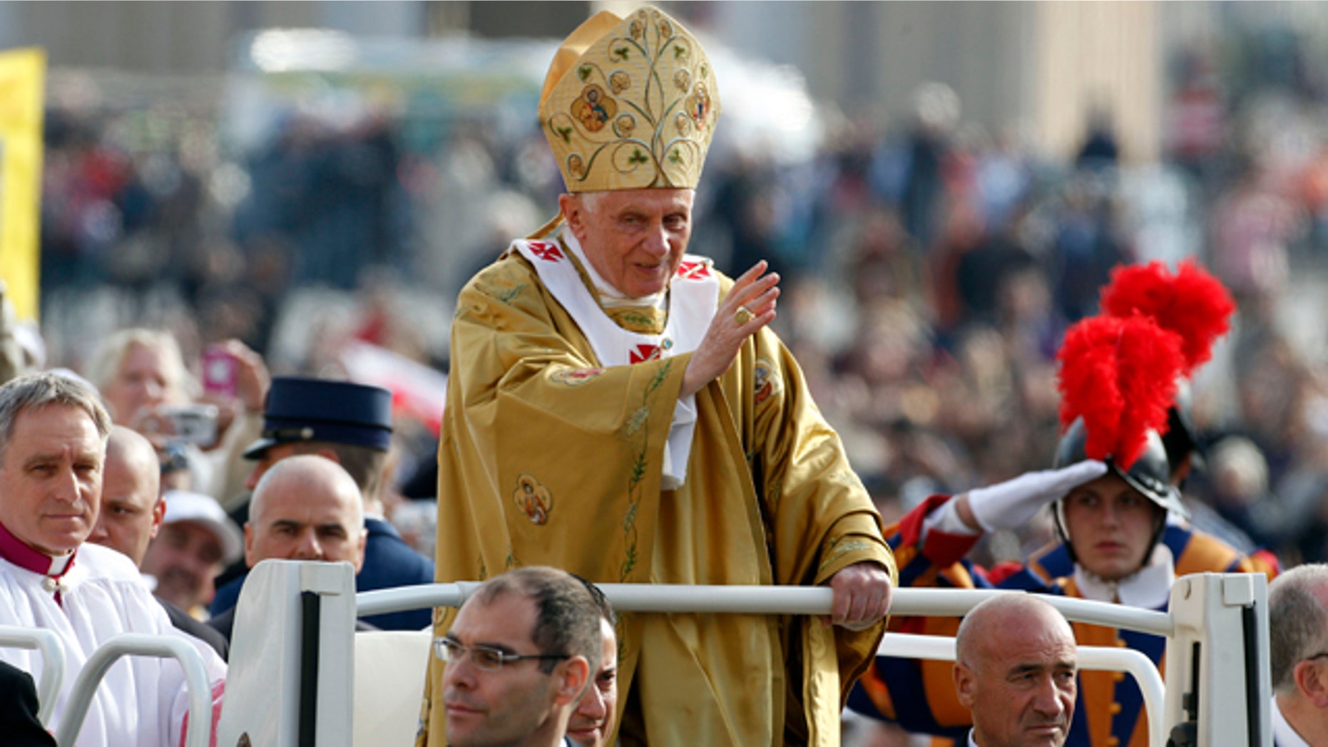 Oct. 23, 2011: Pope Benedict XVI, center, delivers his blessing as he arrives in St. Peter's square at the Vatican to celebrate a beatification mass.