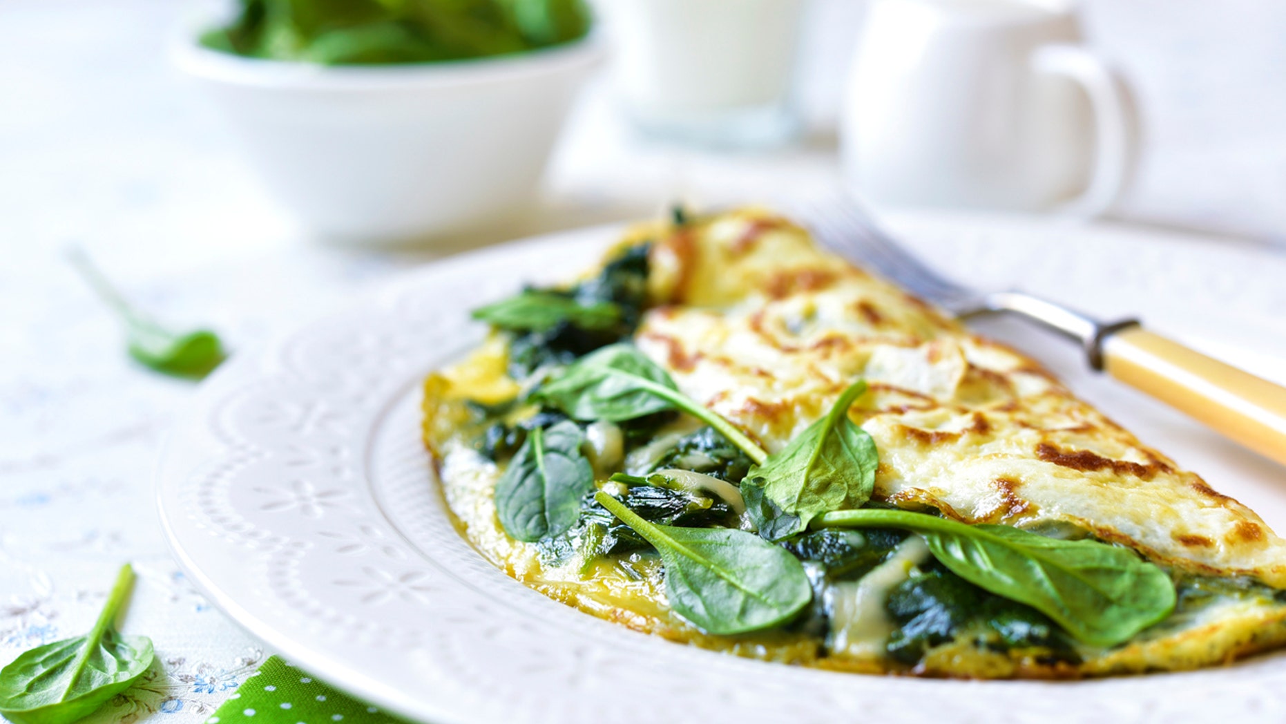 Omelette stuffed with spinach and cheese for a breakfast.