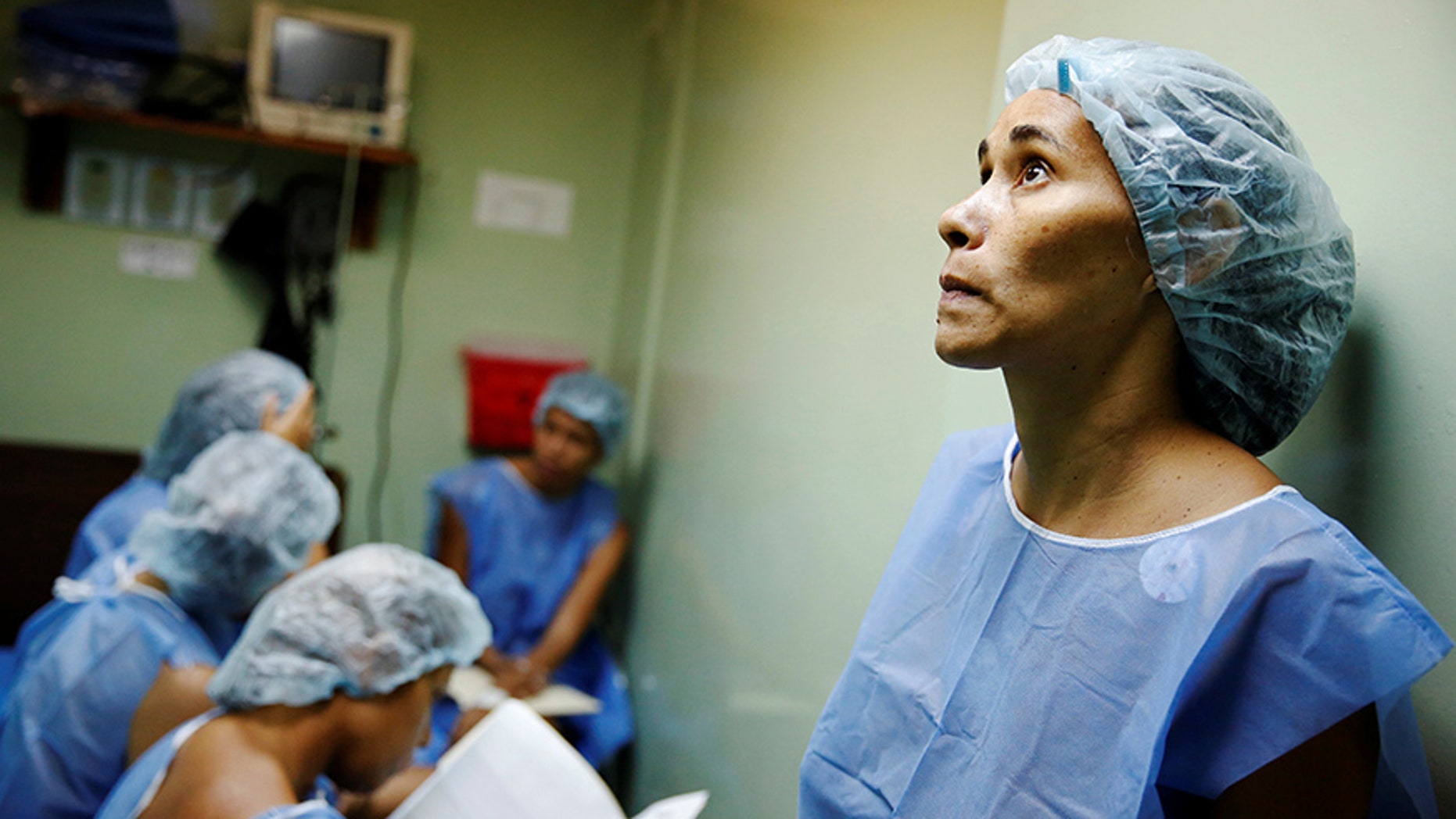 Women wait for sterilization surgery a hospital in Caracas, Venezuela July 27, 2016.
