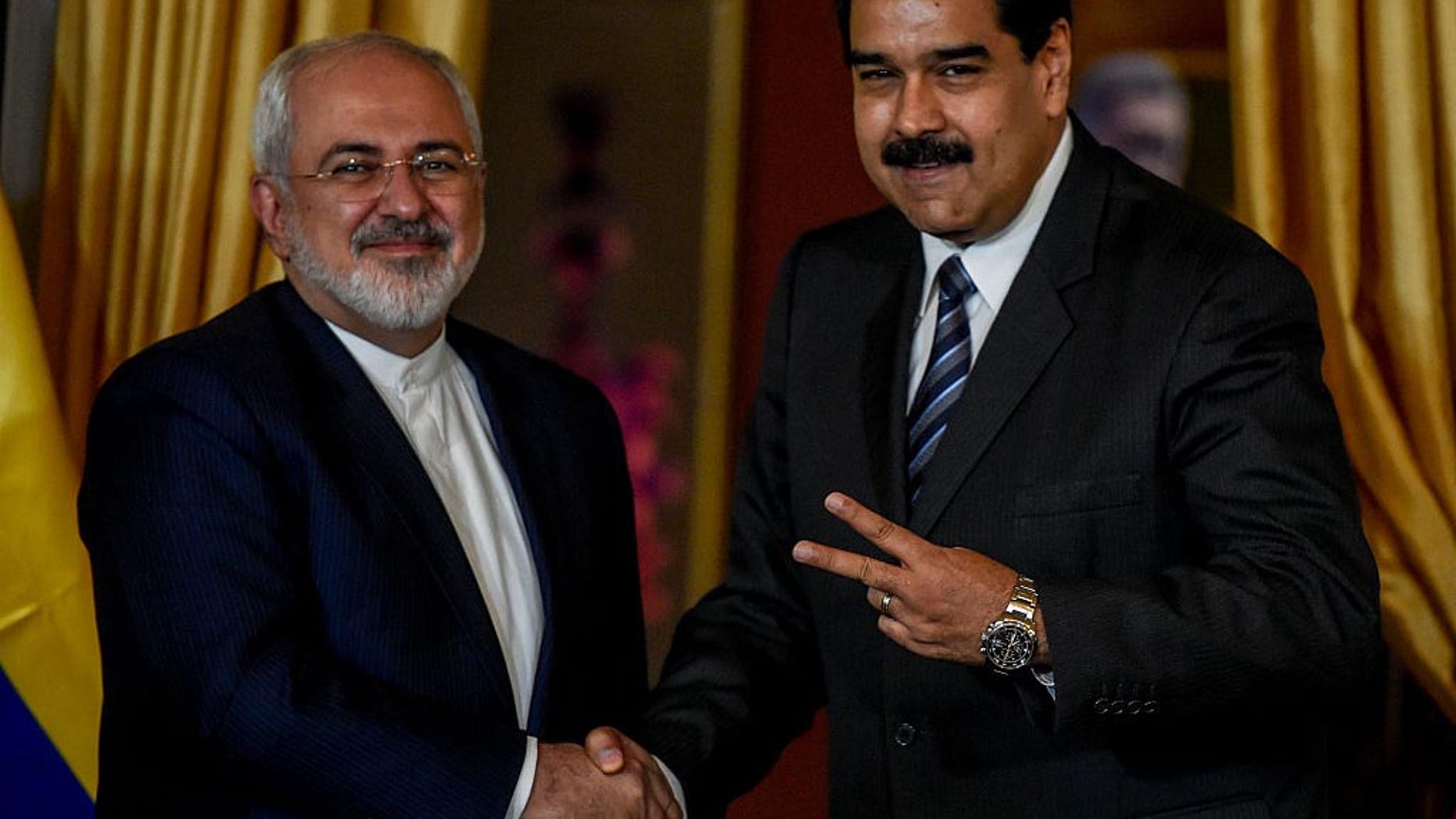 Venezuela's President Nicolas Maduro and Iranian Foreign Minister Mohammad Javad Zarif in Caracas on August 27, 2016.