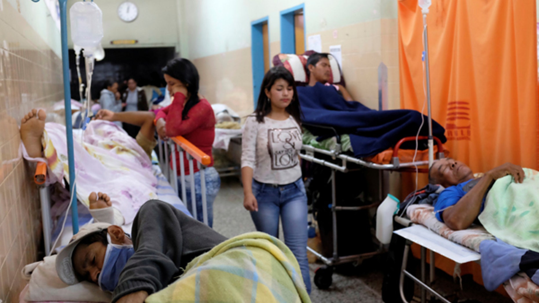 Patients lie on beds in an aisle of the emergency room at the University Hospital in Merida, Venezuela June 17, 2016. Picture taken June 17, 2016.