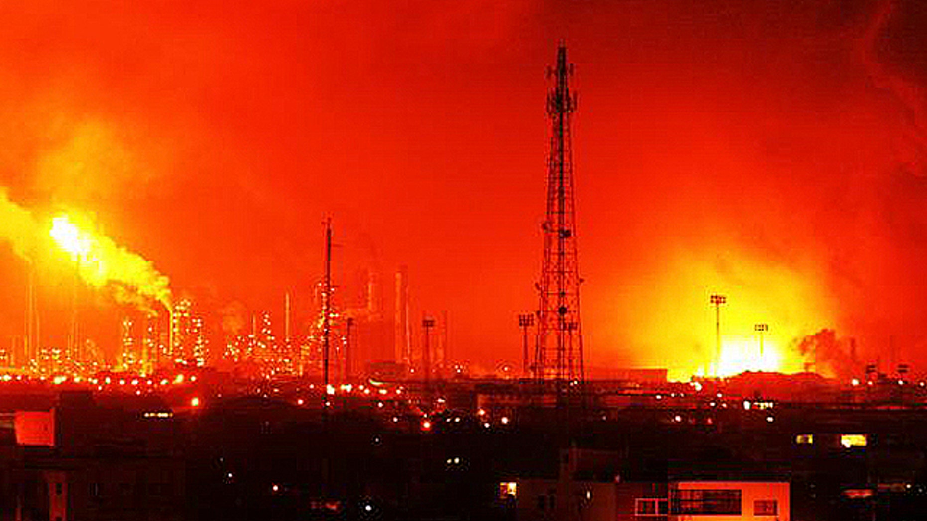 Aug. 25, 2012: Balls of fire rose over Amuay refinery near Punto Fijo, Venezuela. A huge explosion rocked Venezuela's biggest oil refinery, killing at least 24 people and injuring dozens, an official said. (AP)