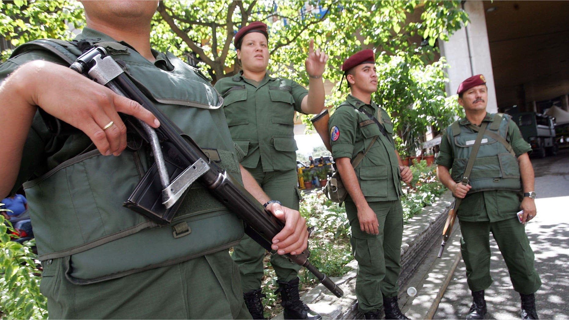 CARACAS, VENEZUELA - DECEMBER 02: Soldiers guard the national elections headquarters December 2, 2006 in Caracas, Venezuela. President Hugo Chavez faces challenger Manuel Rosales in the presidential elections December 3. (Photo by Mario Tama/Getty Images)