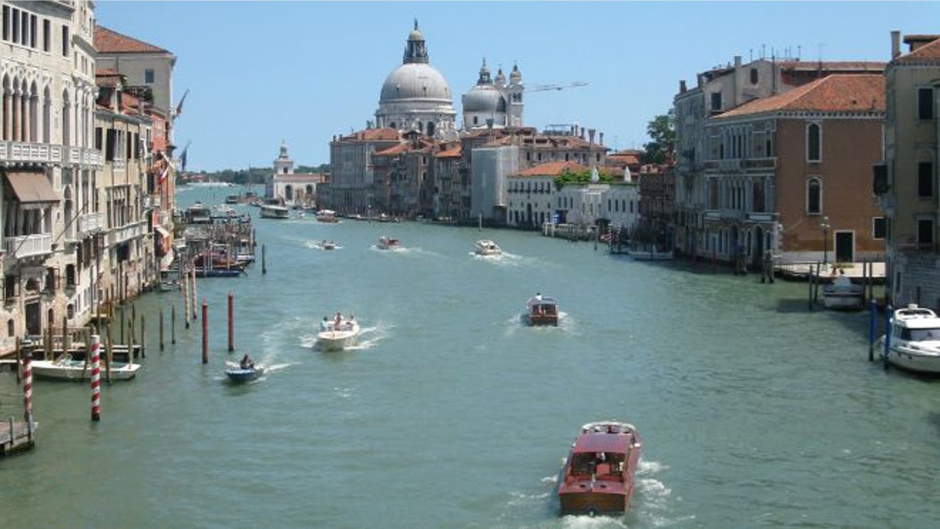 July 17, 2012: Water traffic bustling on the Grande Canale in the heart of Venice, Italy.