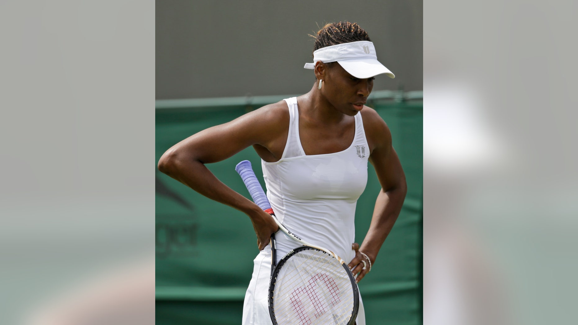 June 25: Venus Williams of the United States reacts during a first round women's singles match against Elena Vesnina of Russia at the All England Lawn Tennis Championships at Wimbledon, England.