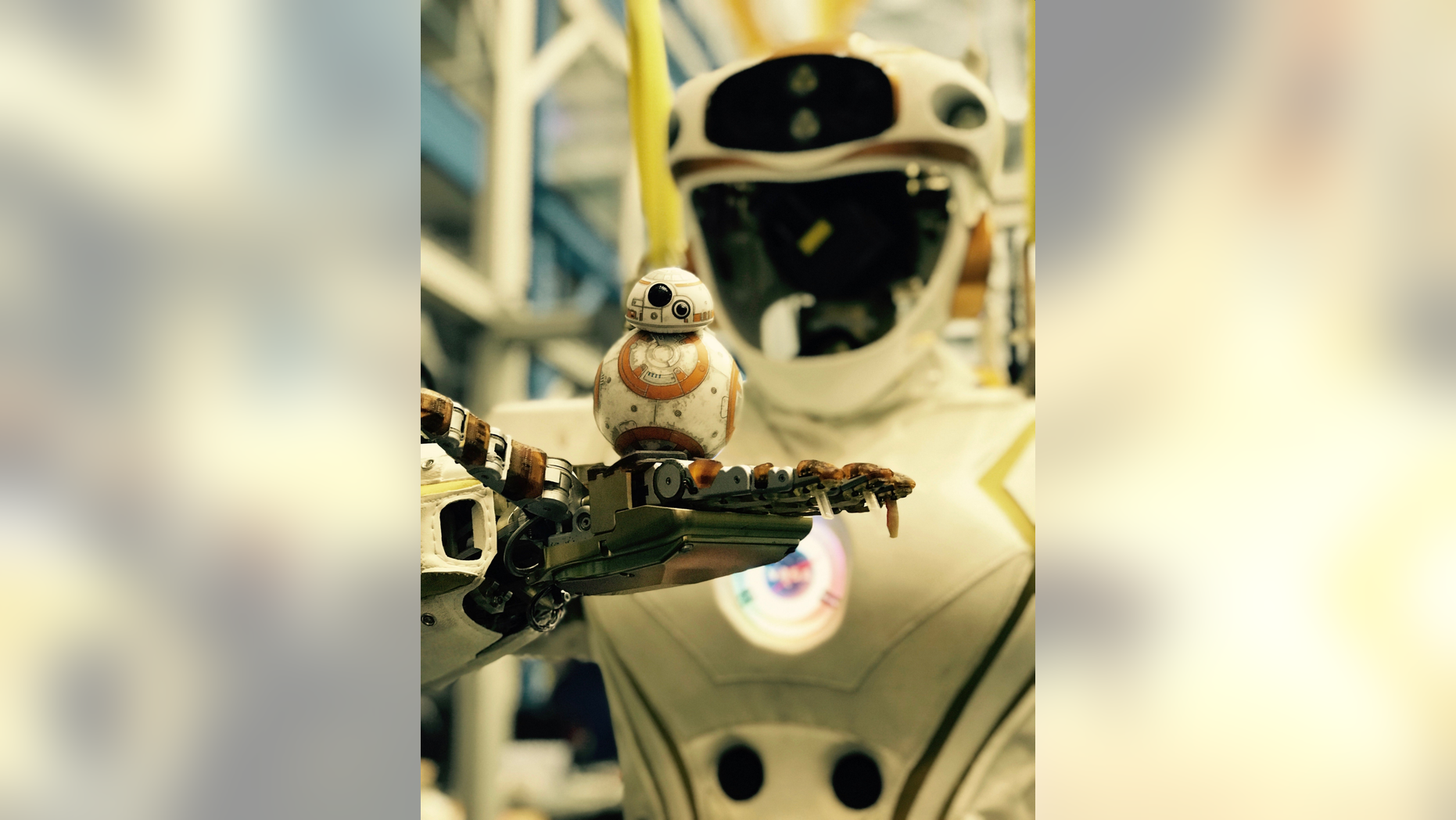 NASA's Valkyrie robot holds a little "Star Wars" BB-8.