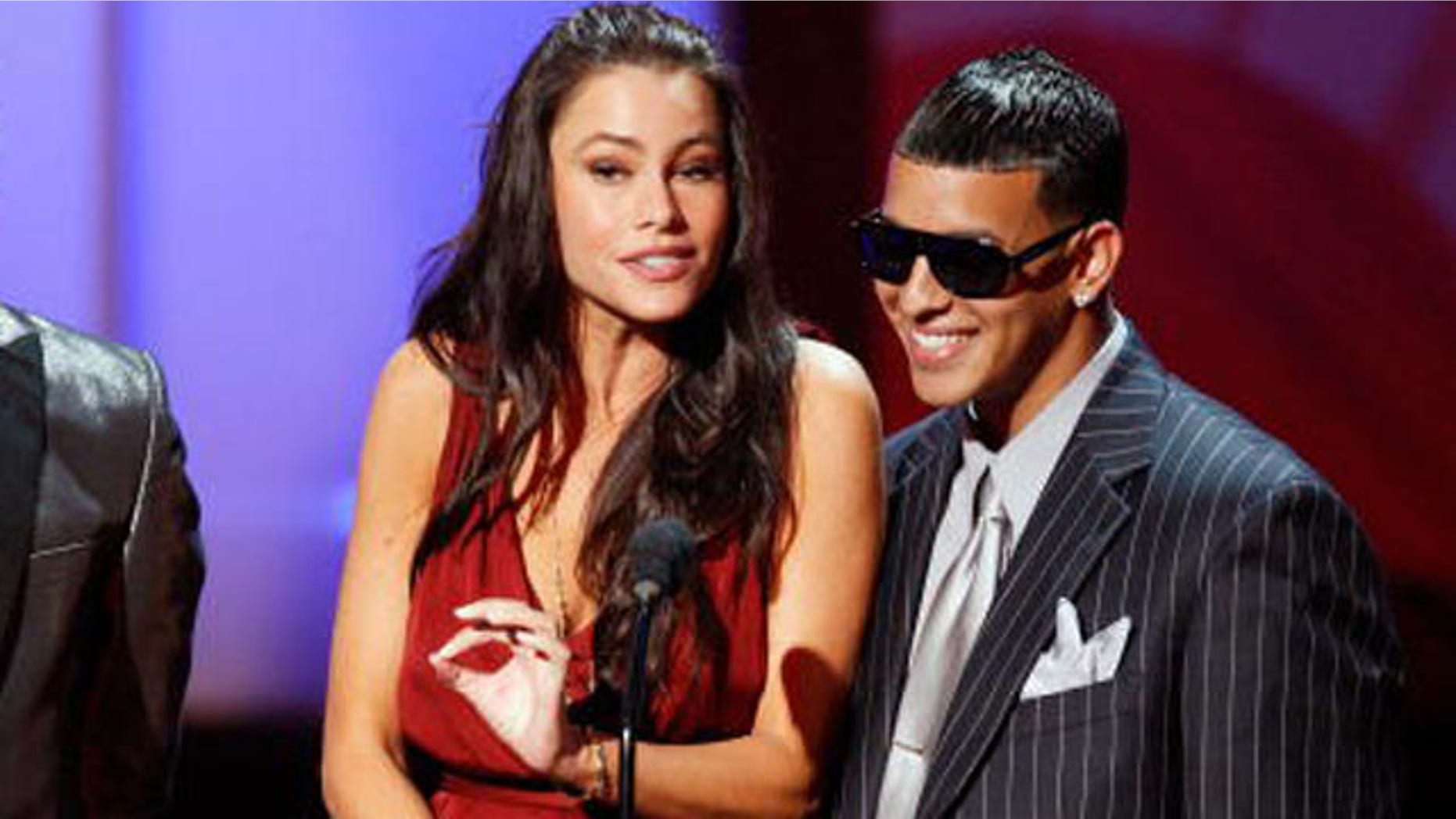 PASADENA, CA - AUGUST 17: (L-R) Rapper Taboo, actress Sofia Vergara, and rapper Daddy Yankee present the Cheetah Girls performance onstage during the 2008 ALMA Awards at the Pasadena Civic Auditorium on August 17, 2008 in Pasadena, California. (Photo by Vince Bucci/Getty Images)