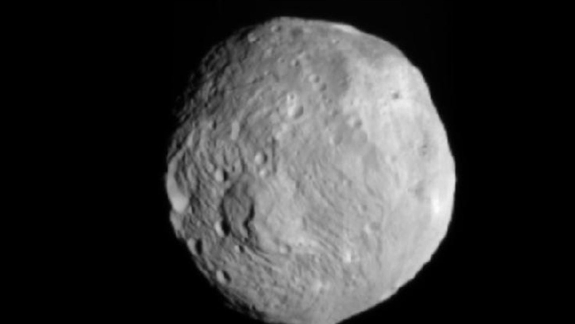 NASA's Dawn spacecraft snapped this photo of the huge asteroid Vesta on July 9, 2011. It was taken from a distance of about 26,000 miles (41,000 kilometers) away from Vesta.