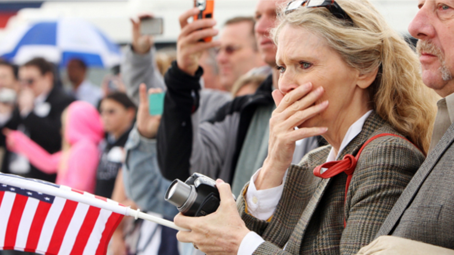 Sept. 25, 2013: Lorna Bird, niece of U.S. Air Force 2nd Lt. Vernal J. Bird, watches as the airplane carrying the remains of her uncle arrives in Salt Lake City.