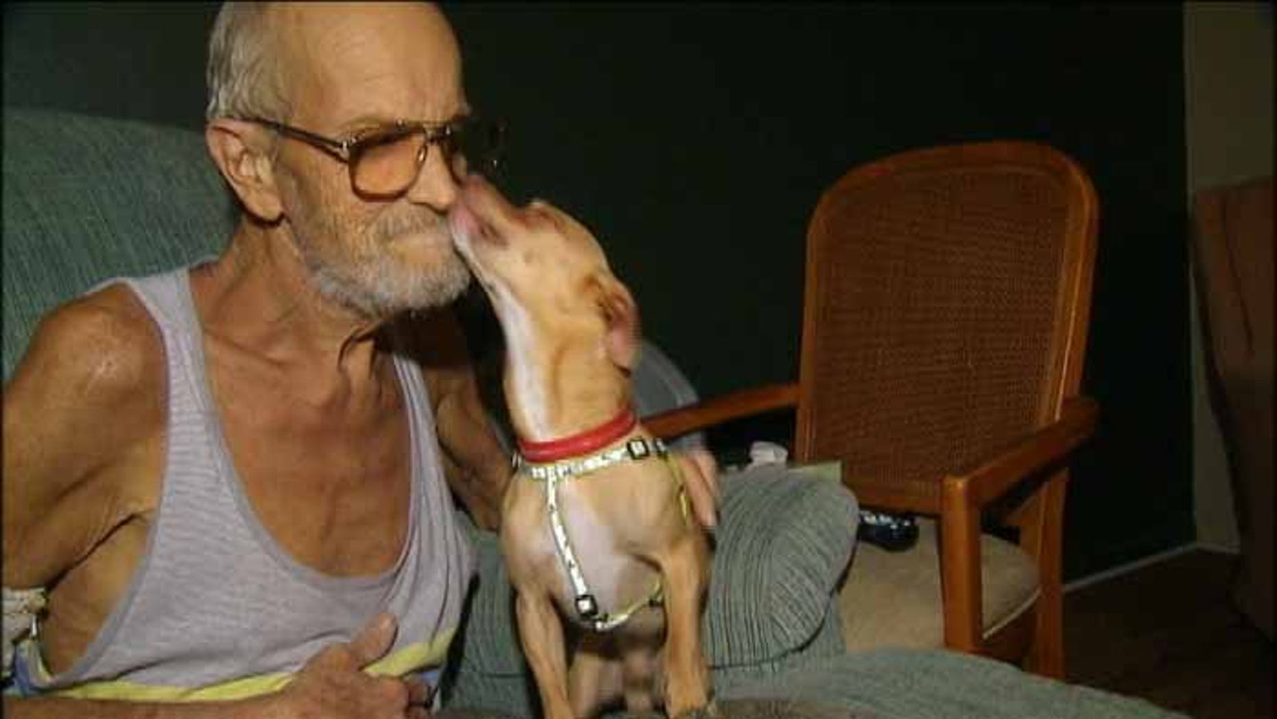 This photo shows John Simpson being reunited with his lost dog Mr. Cutie.