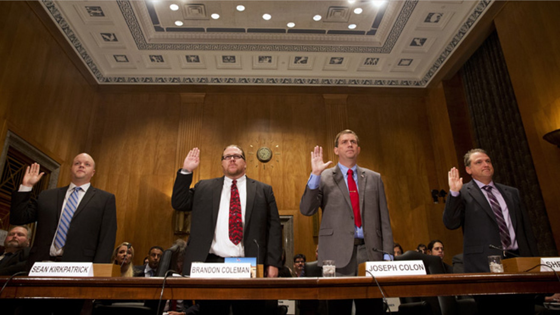 Sept. 22, 2015: From left, Sean Kirkpatrick of Chicago; Phoenix VA Health Care System Addiction Therapist Dr Brandon Coleman; VA Caribbean Healthcare System Credentialing Program Support Joseph Colon, and Overton Brooks VA Medical Center Licensed Clinical Social Worker Shea Wilkes are sworn on Capitol Hill in Washington, prior to testifying before the Senate Homeland Security and Governmental Affairs Committee hearing on "Improving VA Accountability: Examining First-Hand Accounts of Department of Veterans Affairs Whistleblowers." (AP)
