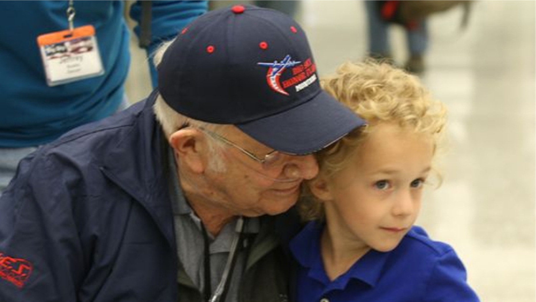 April 27, 2014: Eli Wilke, 6, gives Montana World War II veteran Donald Buska, left, a hug as he arrives at Dulles International airport in Dulles, Va. Buska fulfilled his longtime dream of traveling to Washington and visiting the National World War II Memorial with the help of Big Sky Honor Flight of Montana.