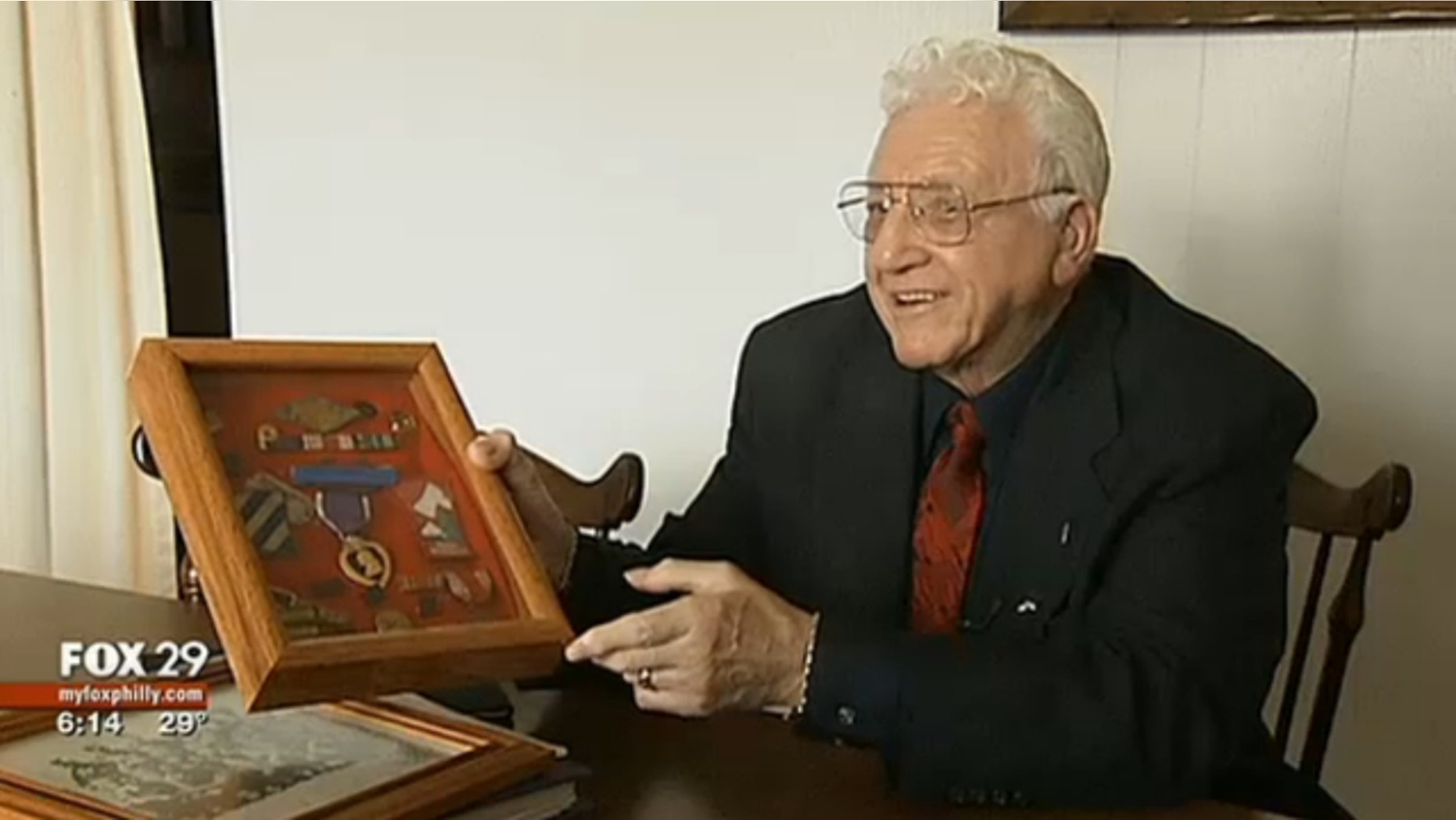 World War II veteran John Warhola appears with medals he earned in combat.
