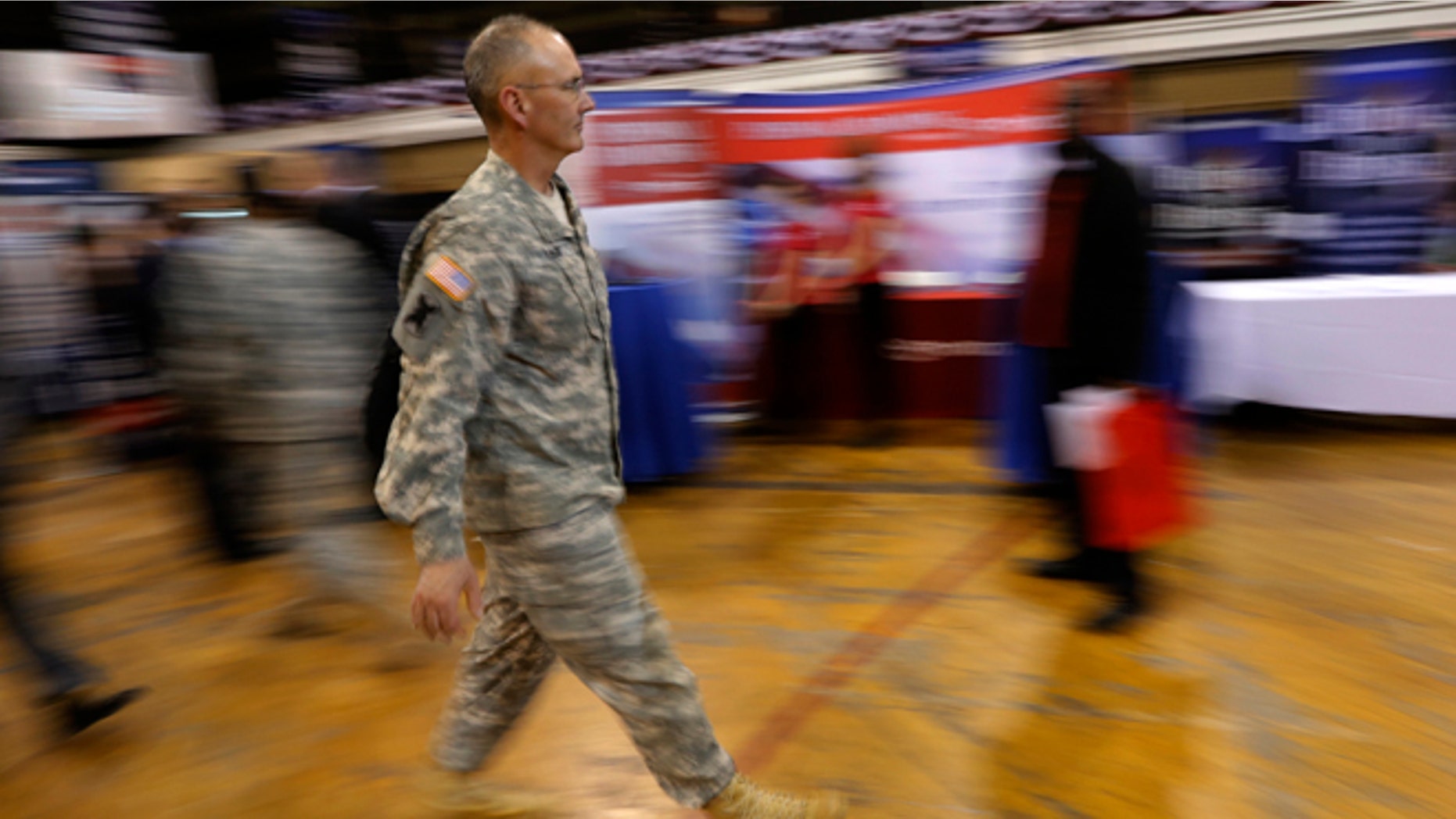 FILE: March 27, 2013: A military officer attends a job fair in New York.