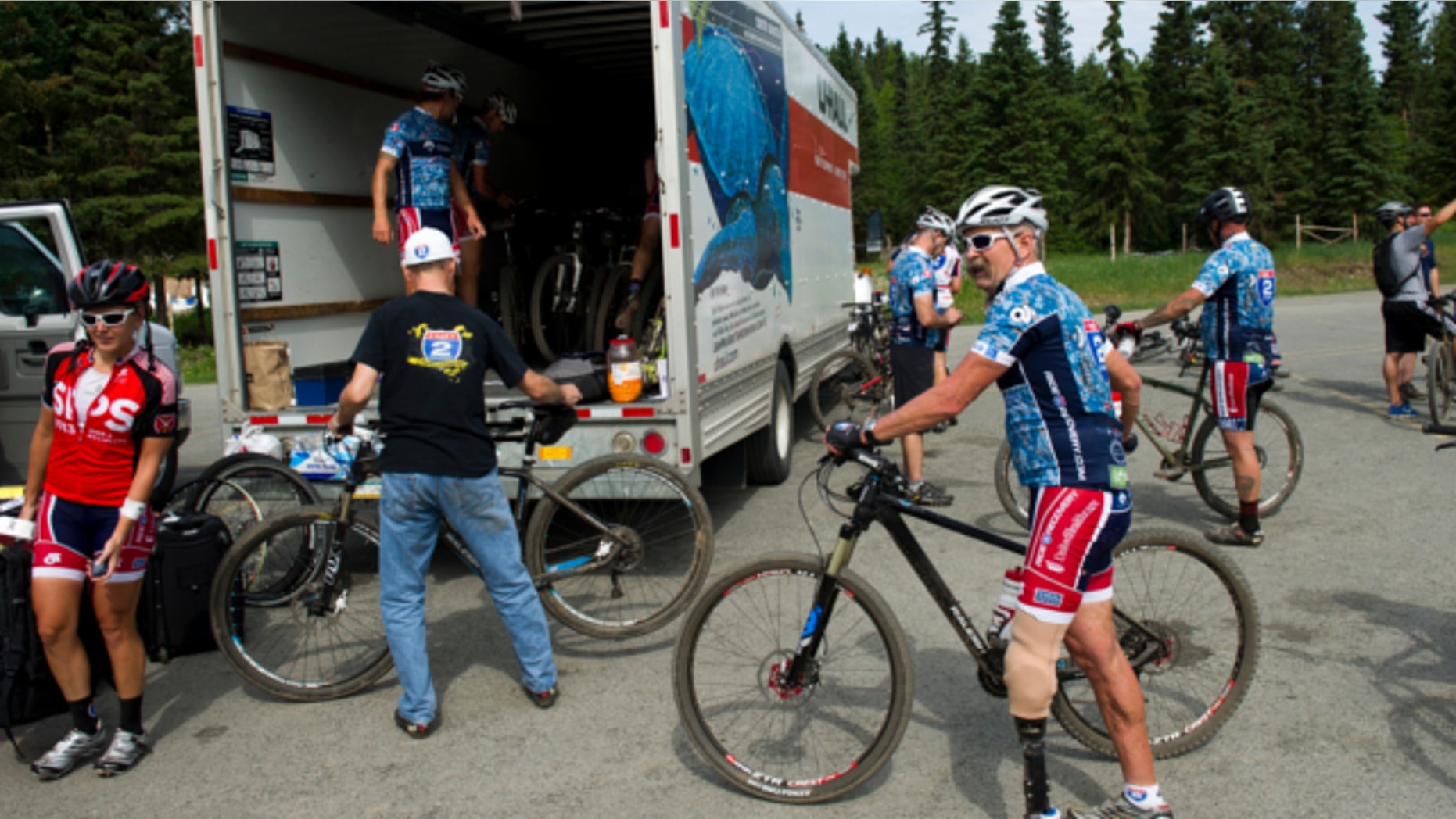 June 25, 2013: Mountain bikers in the Ride 2 Recovery group finish a ride on the Anchorage Hillside.