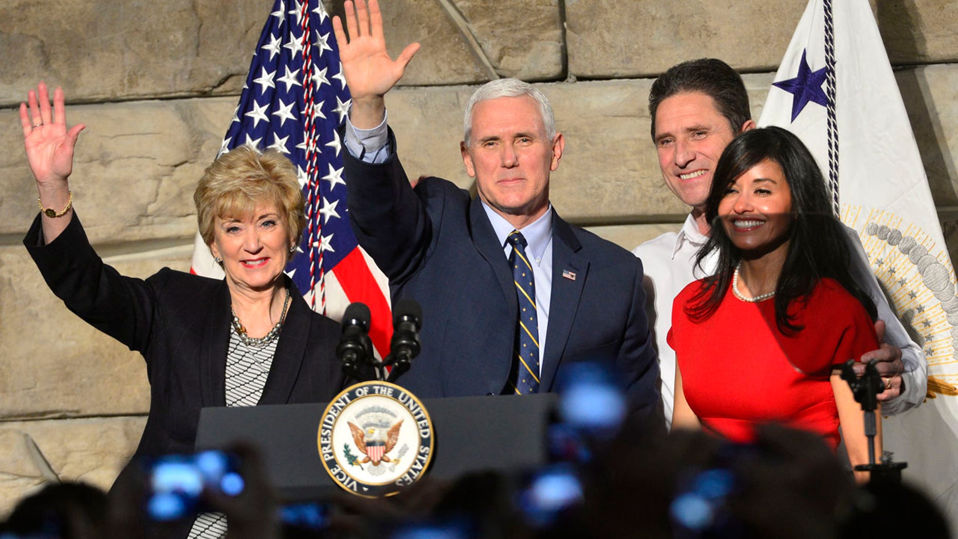 From left, SBA Administrator Linda McMahon, Vice President Mike Pence , Ronald Regan Foster, and Nancy Reagan Foster stand before a crowd on Saturday, March 25, 2017 in Charleston, W.Va.