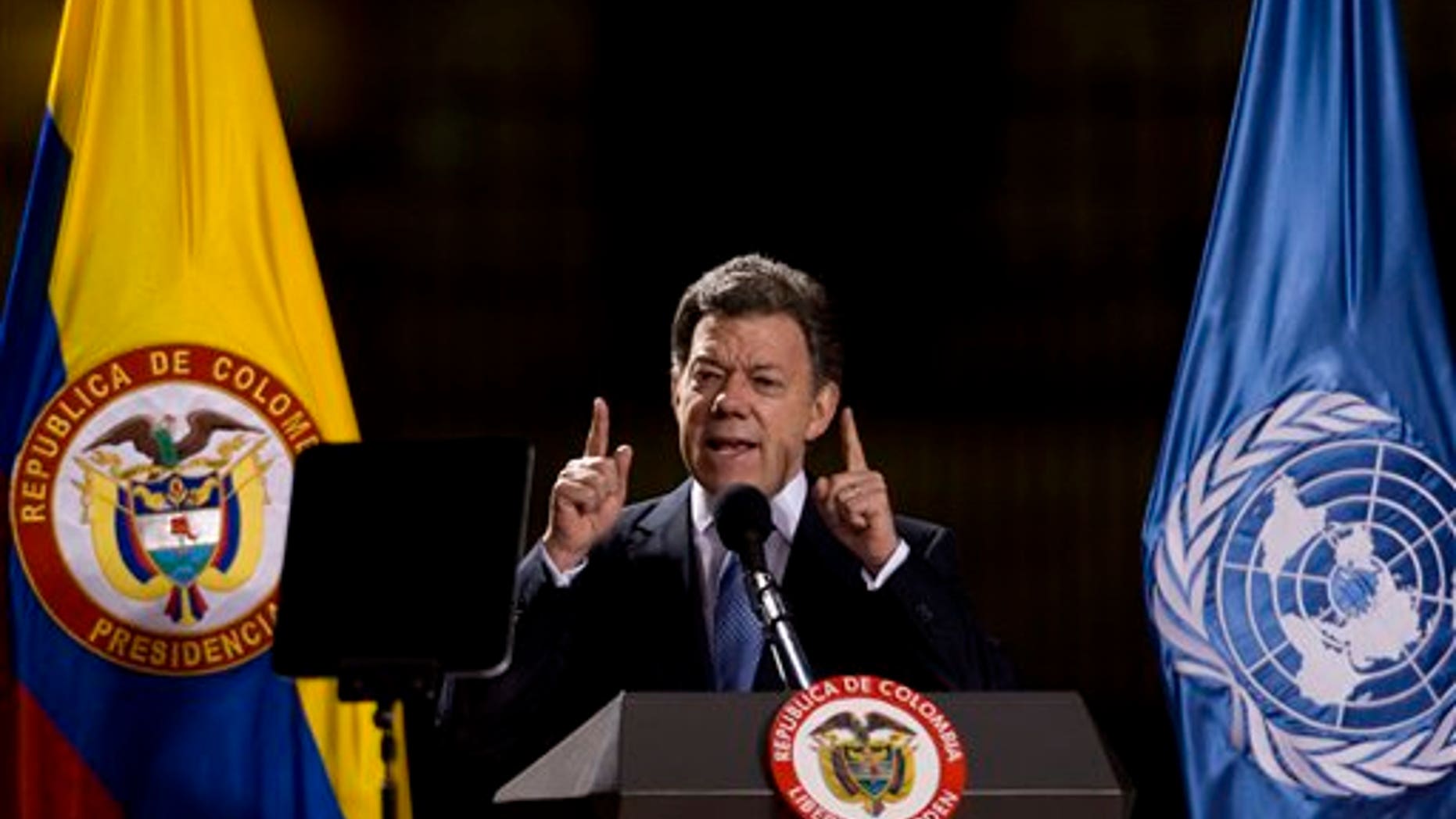 Jun 10: Colombia's President Juan Manuel Santos delivers a speech after signing a law that creates mechanisms to compensate survivors of the country's conflict and the return of stolen land to persons displaced by armed groups in Bogota, Colombia.