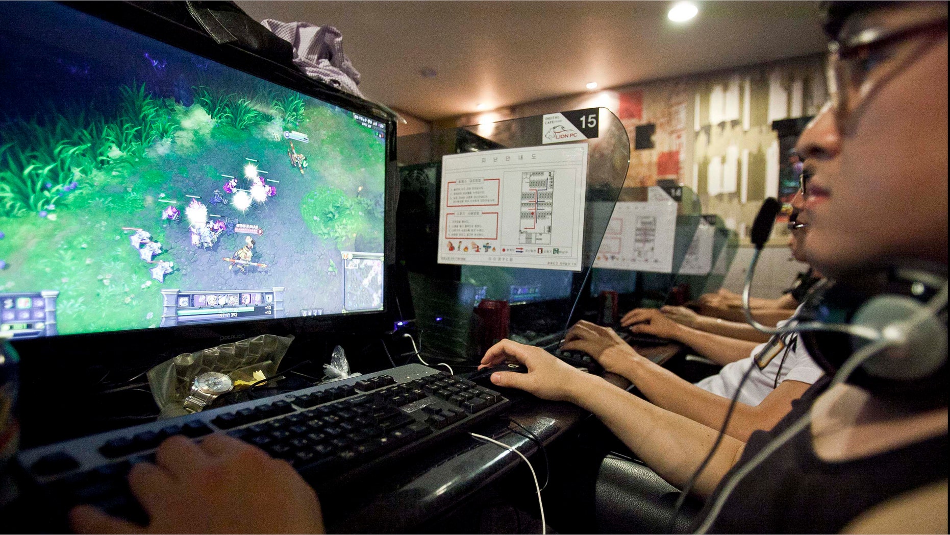 Video-game enthusiasts play "League of Legends" during the "PC Bang (Internet Cafe) Tournament," organized by Riot Games Inc.'s Korea unit, at Lion Internet Cafe in Seoul, South Korea, on Saturday, June 23, 2012. Annual sales of packaged video-games have fallen for three years as consumers move their purchasing to digital downloads and games played on Facebook Inc. and other social sites. Photographer: Jean Chung/Bloomberg via Getty Images