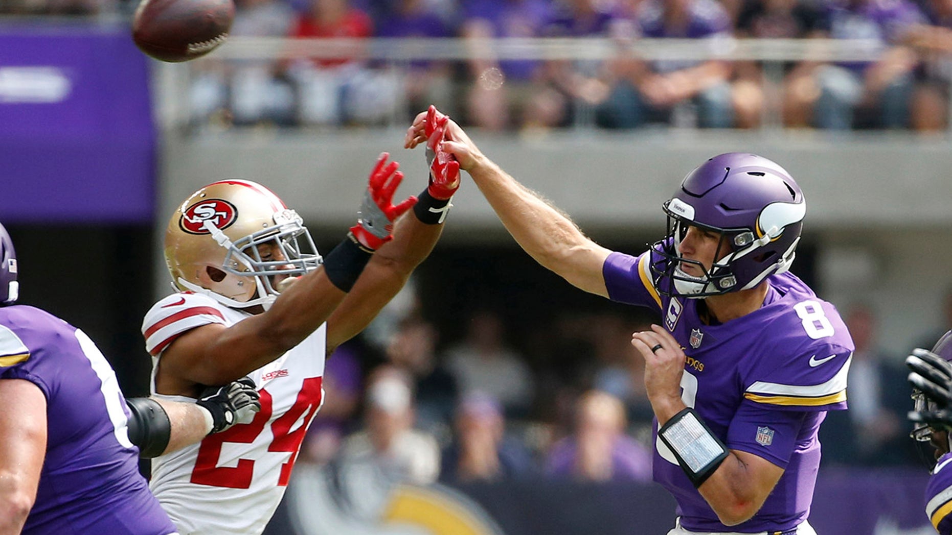 Minnesota Vikings quarterback Kirk Cousins (8) throws a pass over San Francisco 49ers defensive back K'Waun Williams (24) during the first half of an NFL football game, Sunday, Sept. 9, 2018, in Minneapolis. (AP Photo/Bruce Kluckhohn)